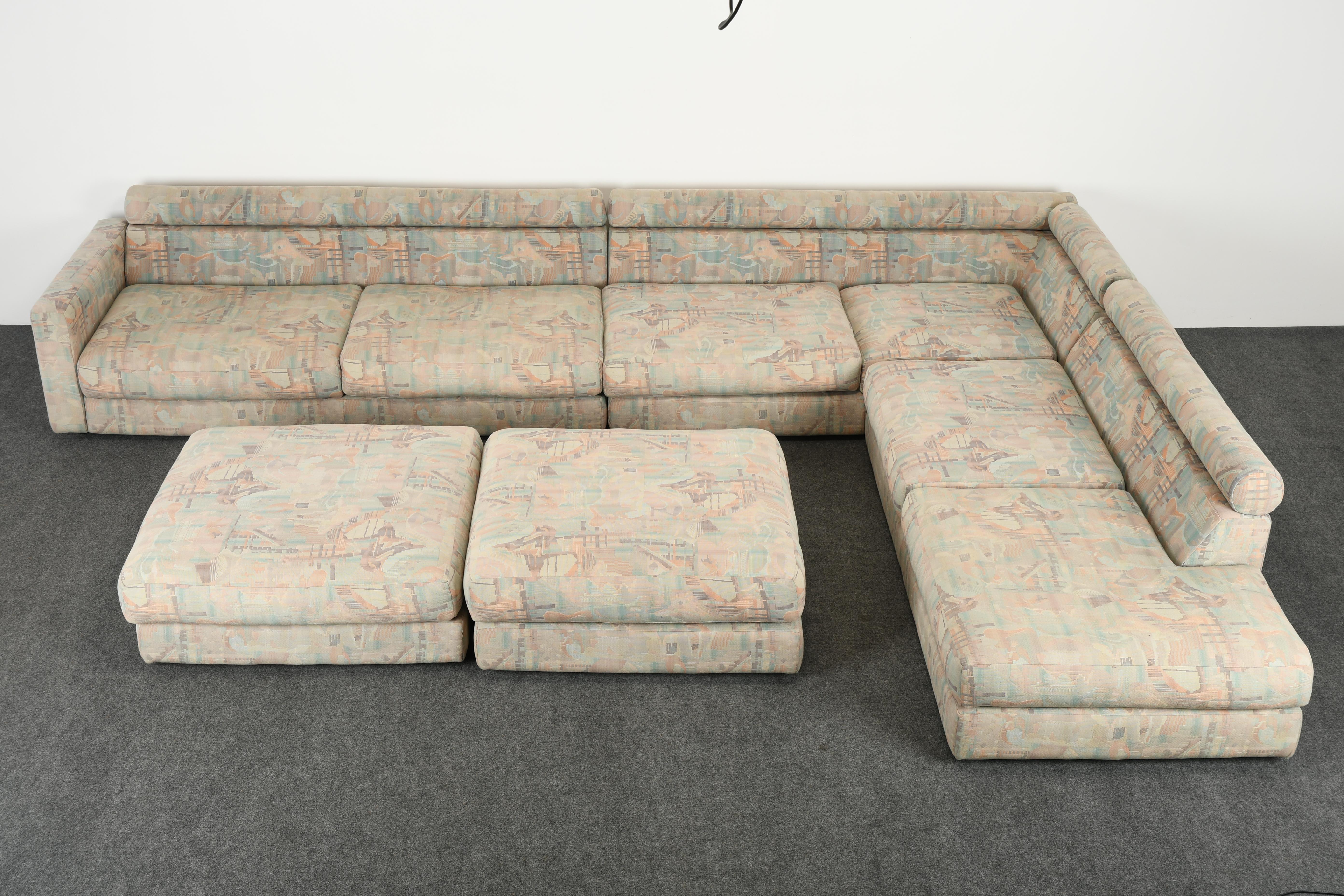 A fabulous monumental Roche Bobois sectional sofa with original fabric and pillows. This beautiful sofa can be used with its original upholstery temporarily however we are selling it as new upholstery recommended. It is a great form to reupholster