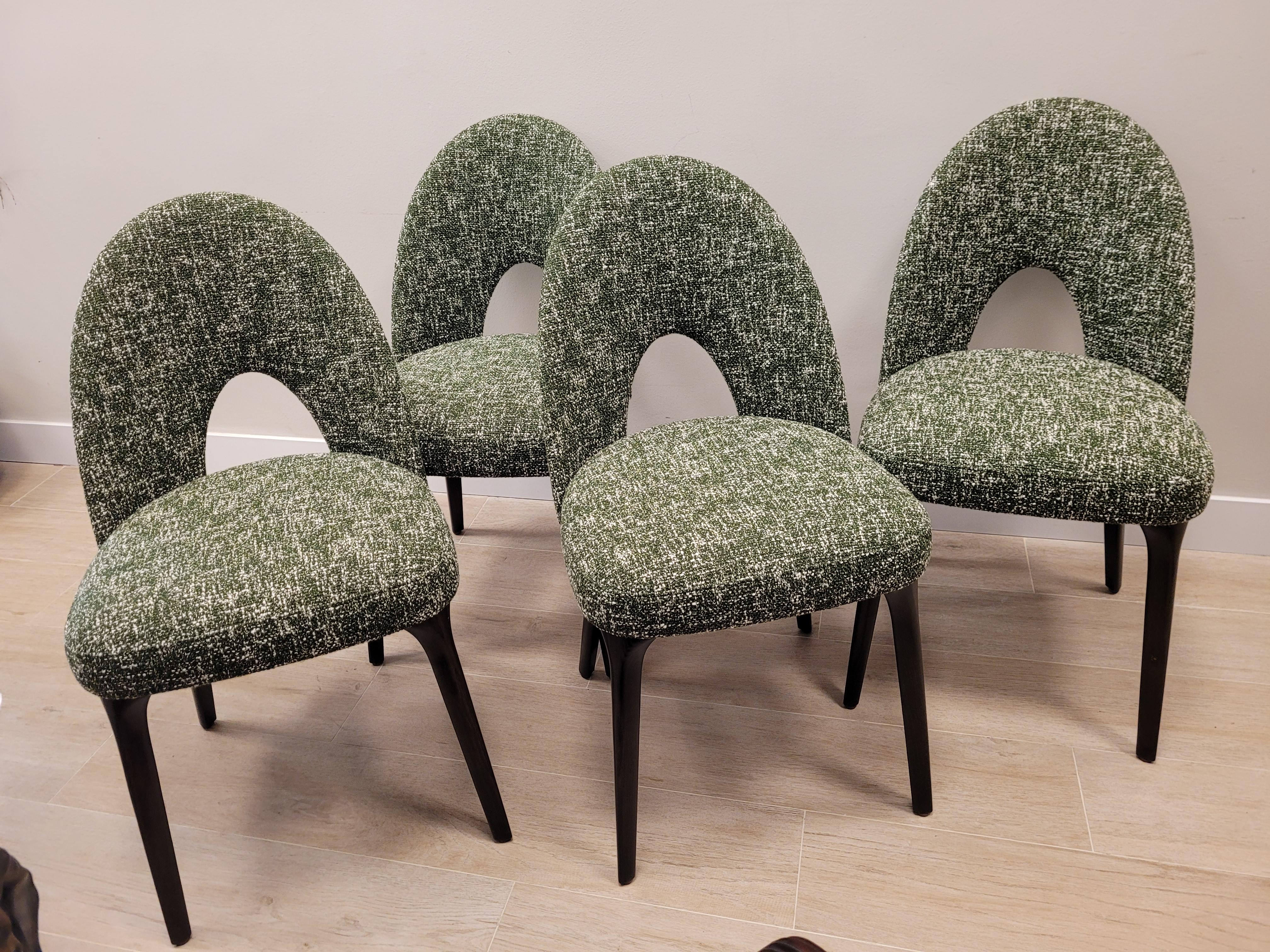 Gorgeous Set of four Flynn chairs by Roche Bobois. The structure is made of solid beech wood. Its original open and curved backrest makes it a very comfortable chair, which is perfect for placing in a dining room or living room.

All of them are