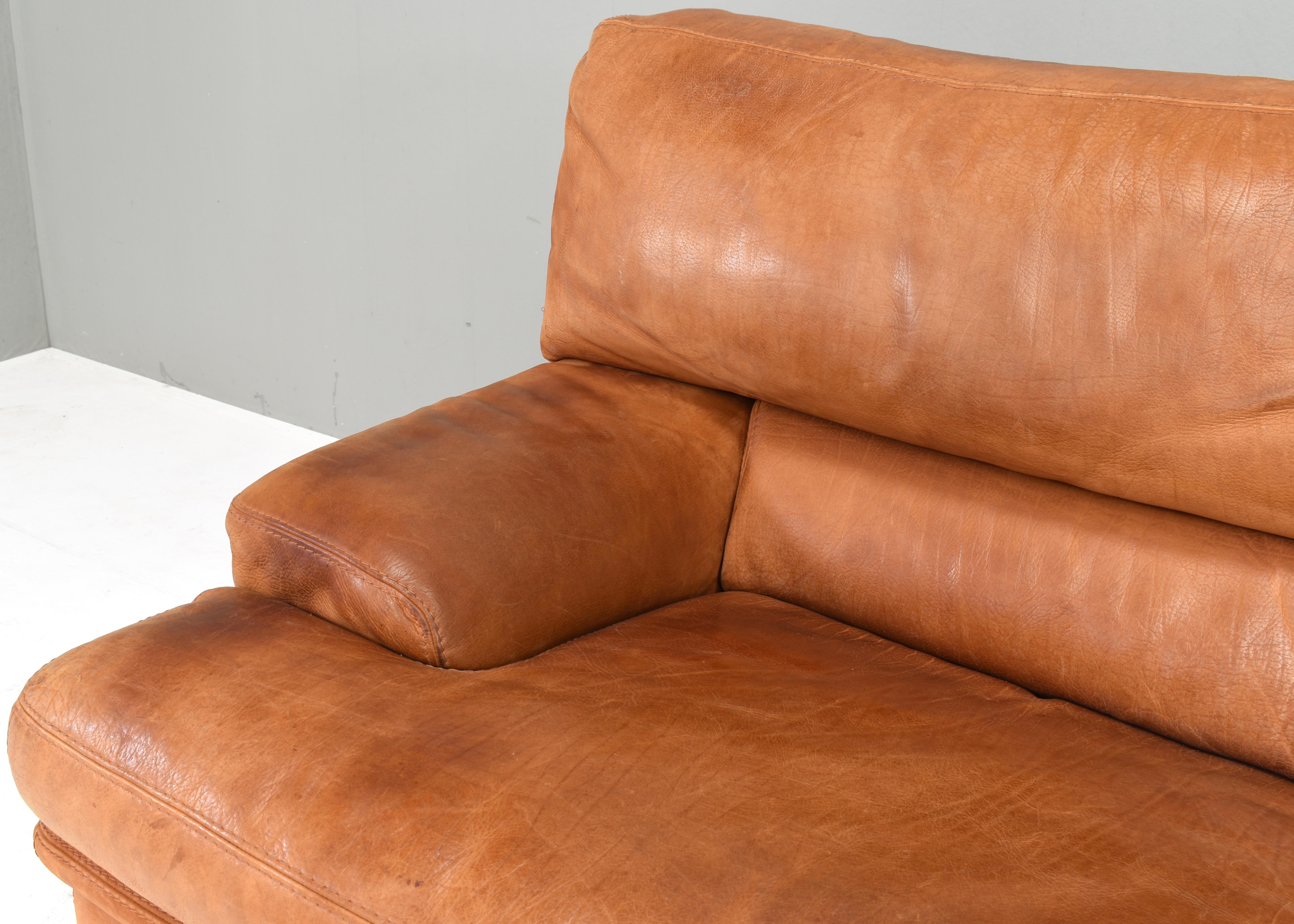 Leather Roche Bobois sofa in patinated Tan / Cognac leather – France, circa 1970/80 For Sale