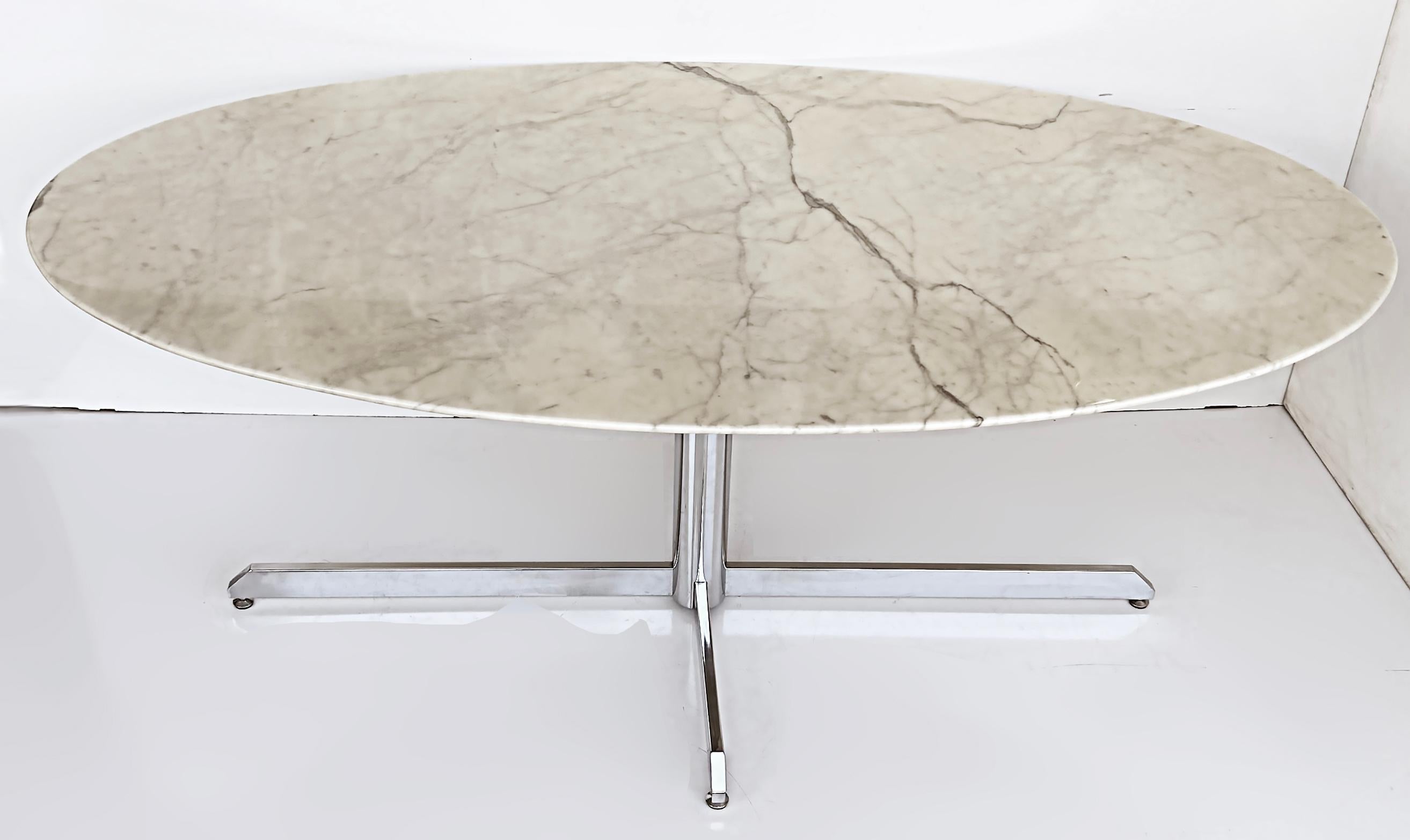 Roche Bobois stainless steel marble dining table, Knoll Style
Offered this Roche Bobois stainless steel and marble dining table created in the style of Florence Knoll. The elongated oval dining table is supported by a polished stainless steel