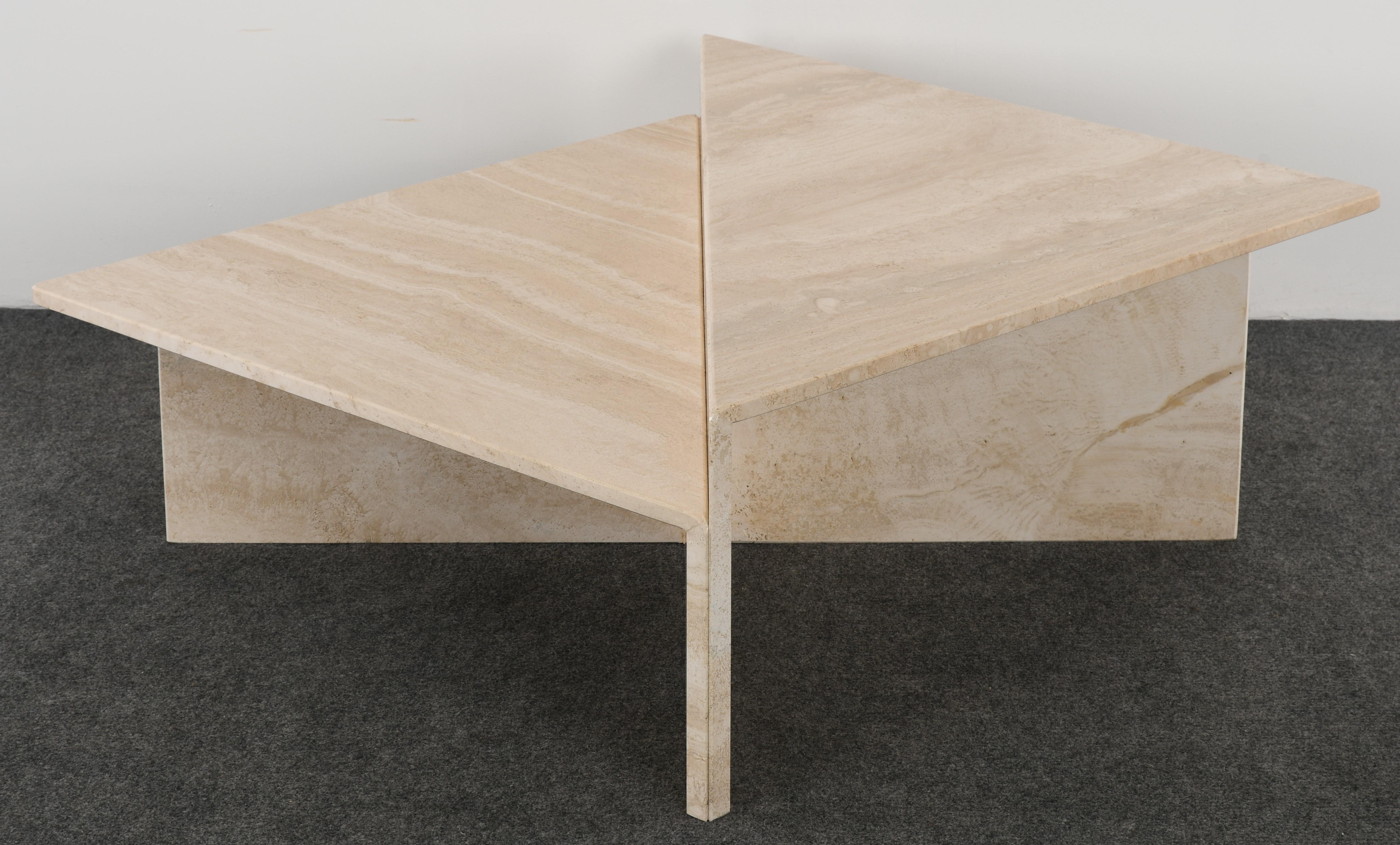 A Roche Bobois style two piece architecturally designed travertine marble two-tiered coffee table. This unique and versatile cocktail table or coffee table set can be used in a modern or traditional setting. In good condition with age-appropriate