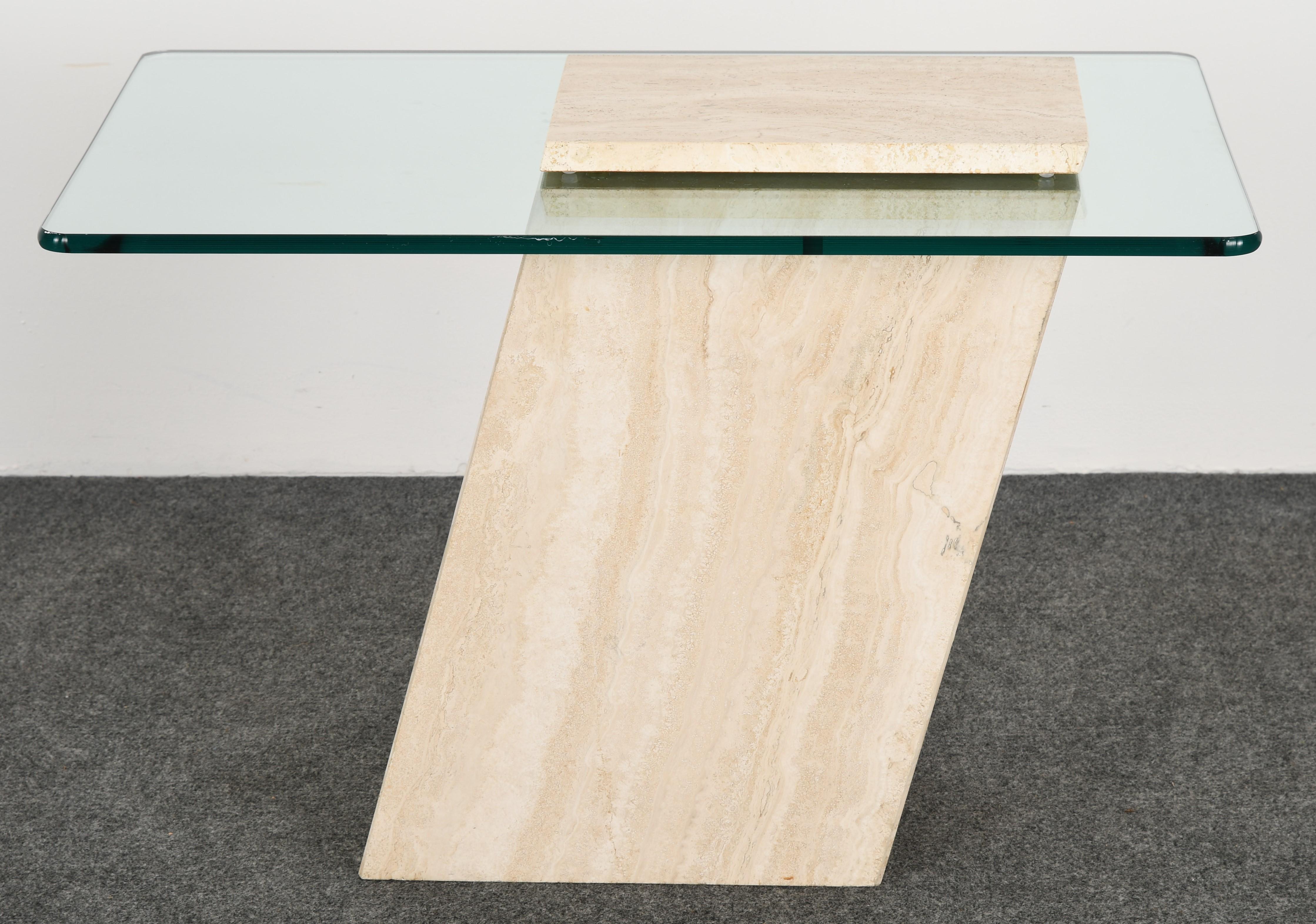 A modernist cantilever travertine side table or occasional table with glass top in the manner of Roche Bobois. This table is structurally sound but has one repair to corner as shown in images. 

Dimensions: 20.5