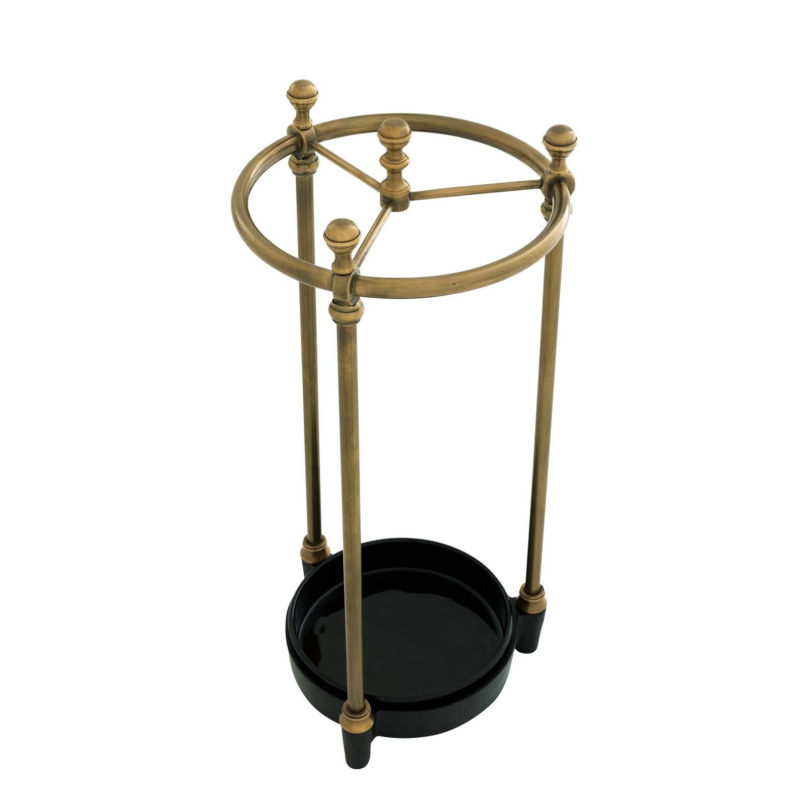 Umbrella stand rock brass with structure
in solid brass in antique finish, with black
ironed base.