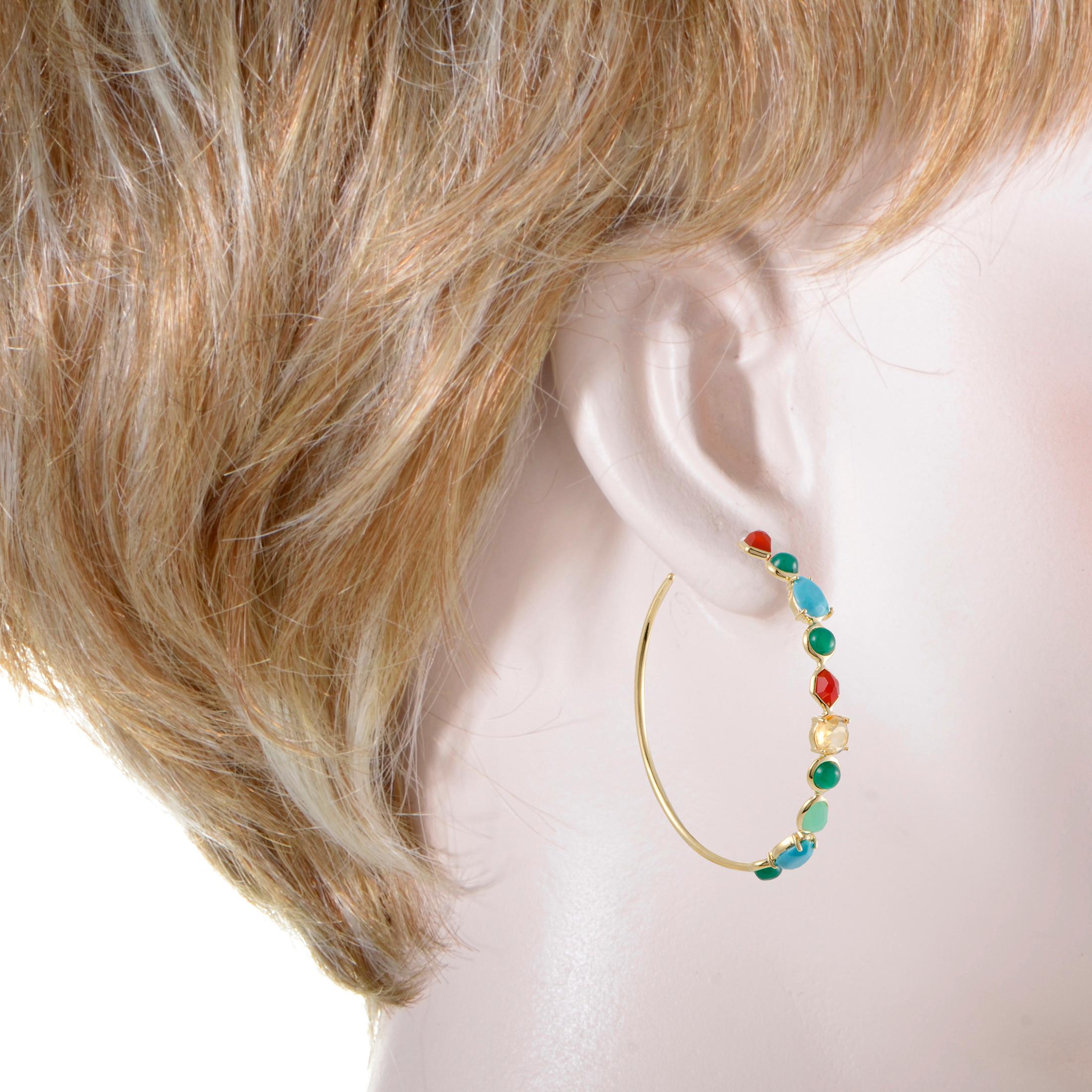 Both whimsical and elegant thanks to the ingenious combination of alluring 18K yellow gold and diversely cut colorful gems, these hoop earrings offer tasteful eye-catching appearance. The pair is designed by Ippolita for the spectacular “Rock Candy”