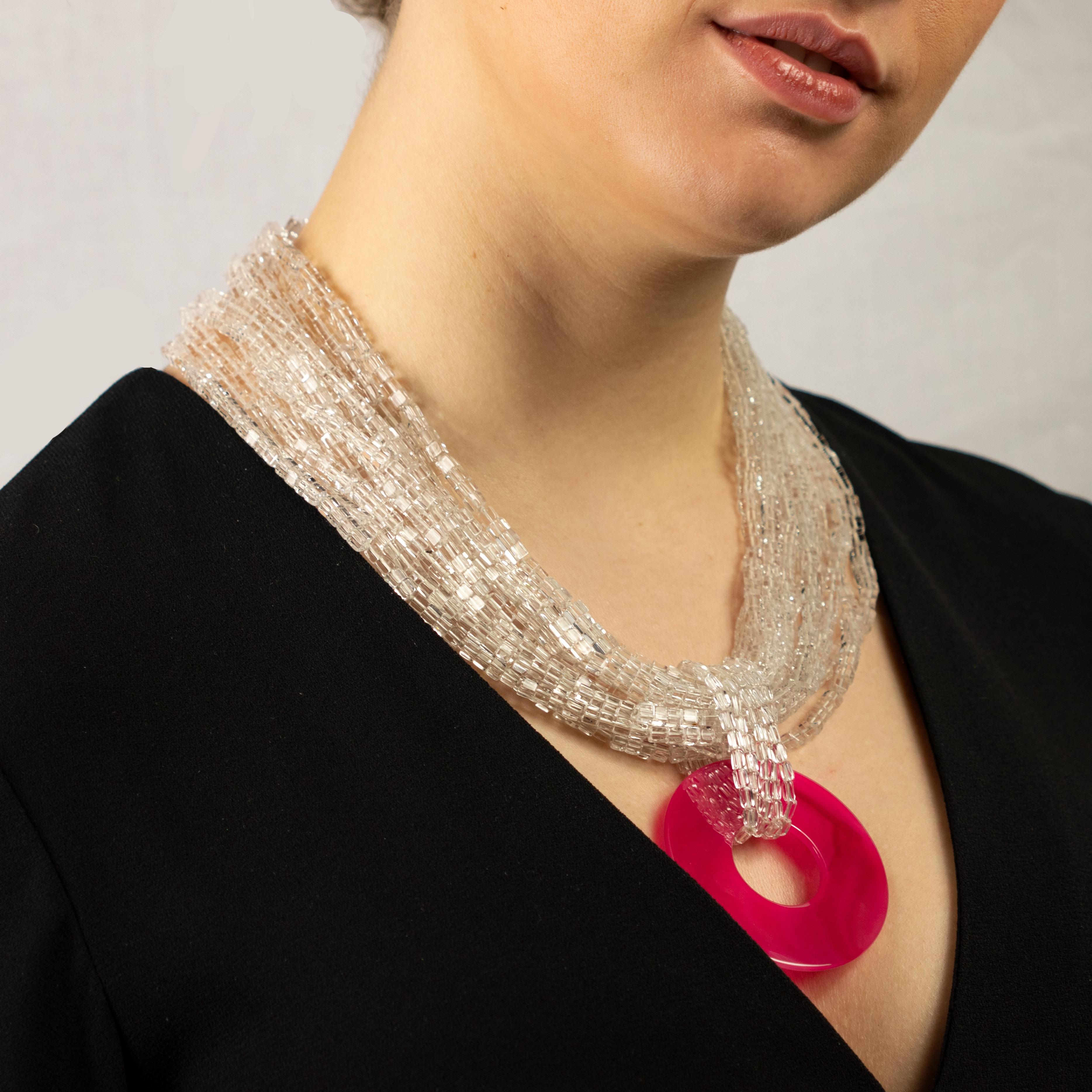 Flashing and romantic necklace in crystal rock with a fuchsia agate medallion. This design is inspired by the spring, more exactly the fuchsia tulips in late April in Holland. 

The power of the crystal and the agate manage to balance the energies