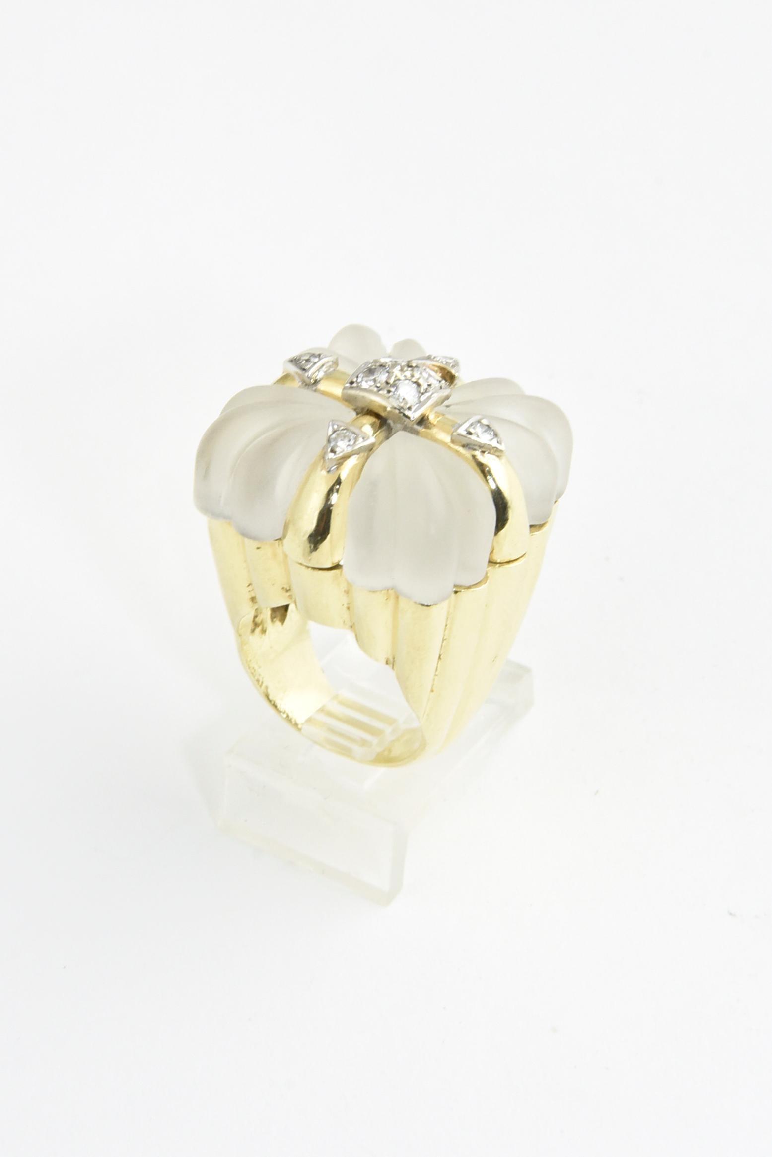 1970s Carved rock crystal cocktail ring designed to look like a present.  The gold ribbon across the top is accented with 8 diamonds with an approximate total weight of .60 carats.  The ring is 18k yellow gold.  The rock crystal as well as the gold