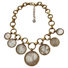 Collana con charme in cristallo di rocca e bronzo dorato