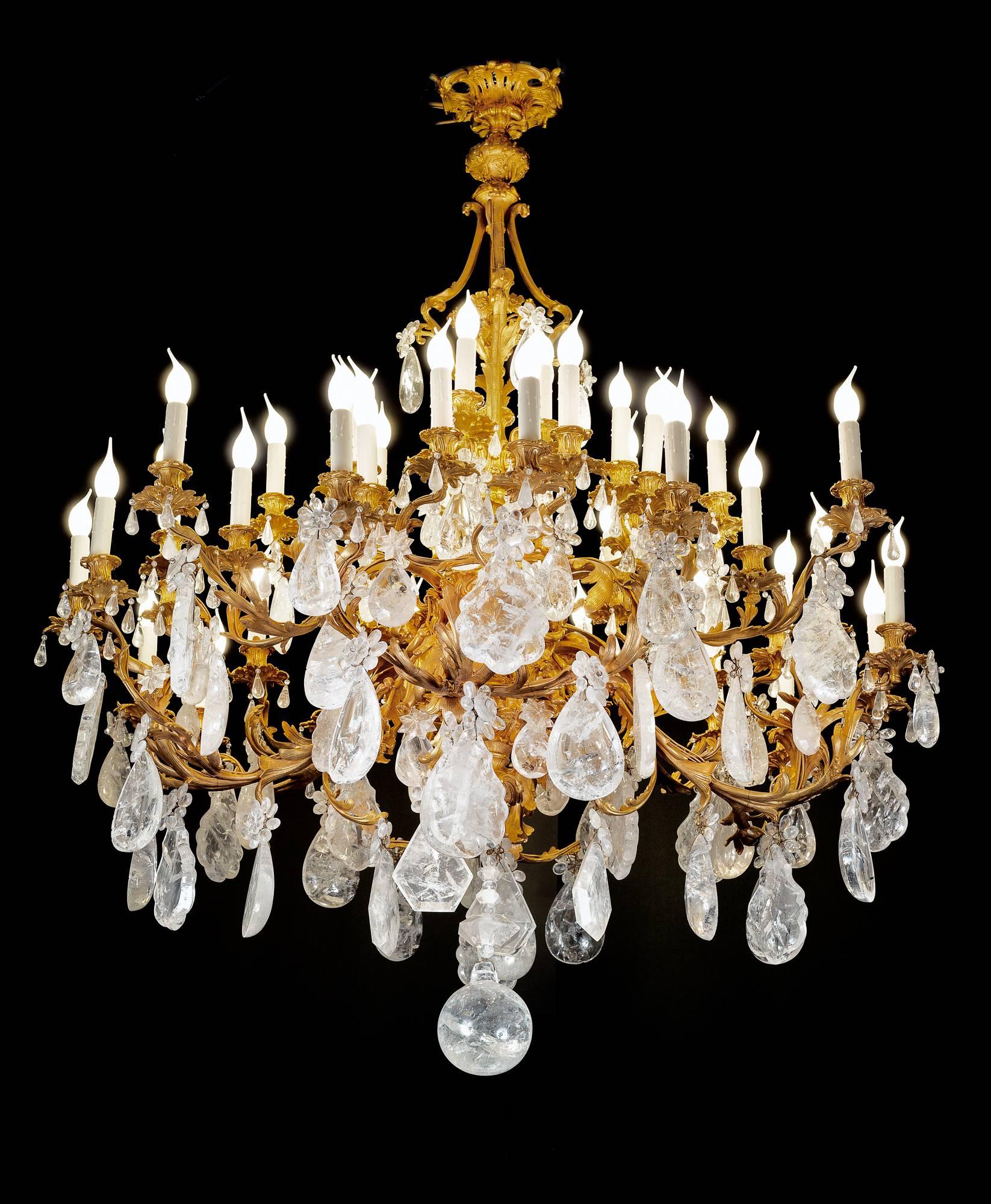 Ormolu bronze chandelier in style of Louis the XVth. 
Modern rock crystal stones specially carved for this model.
48 lights.
 Unique.