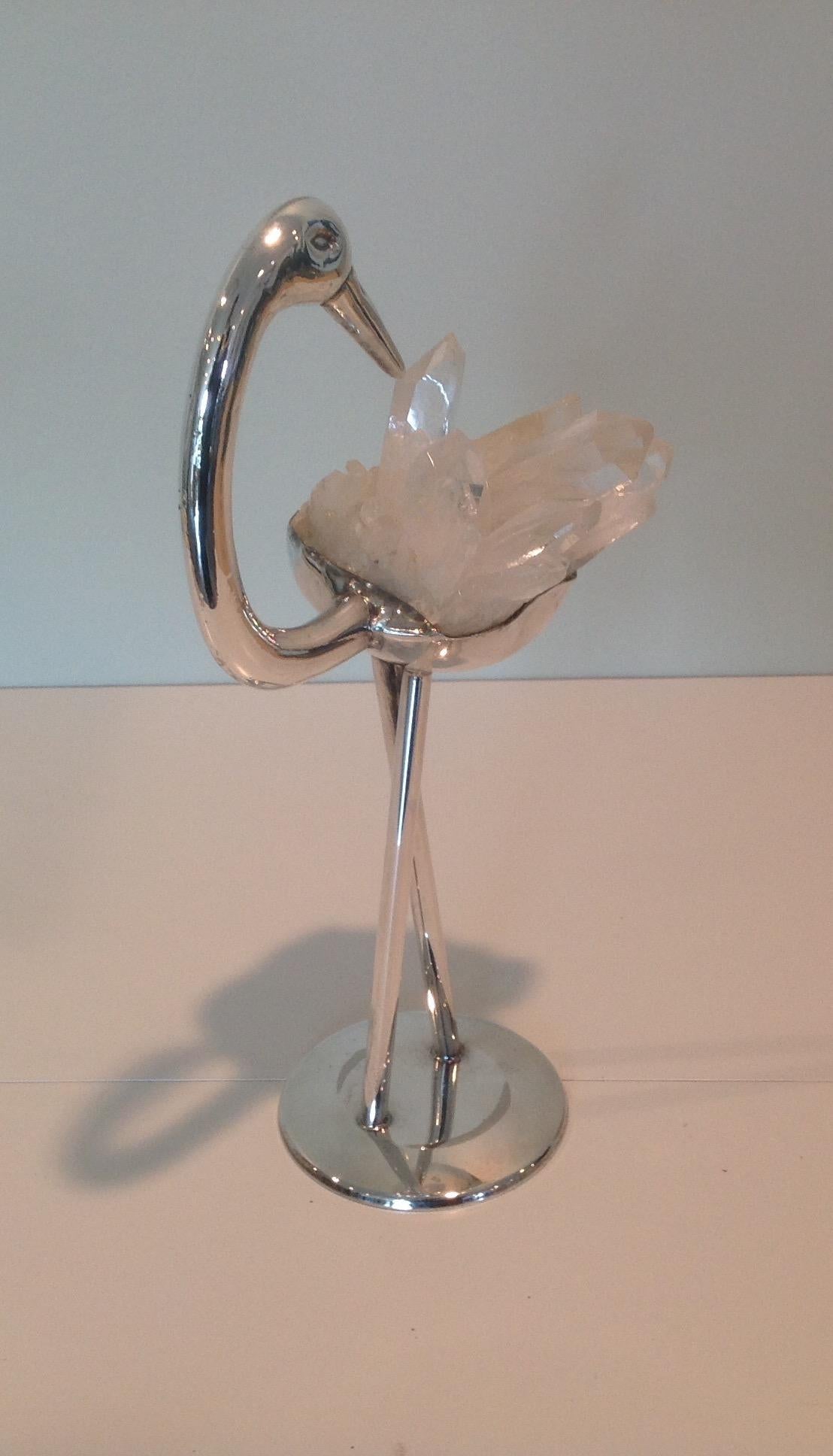 Amazing bird sculpture in silver plate and rock crystal. The piece is artist signed as pictured.
