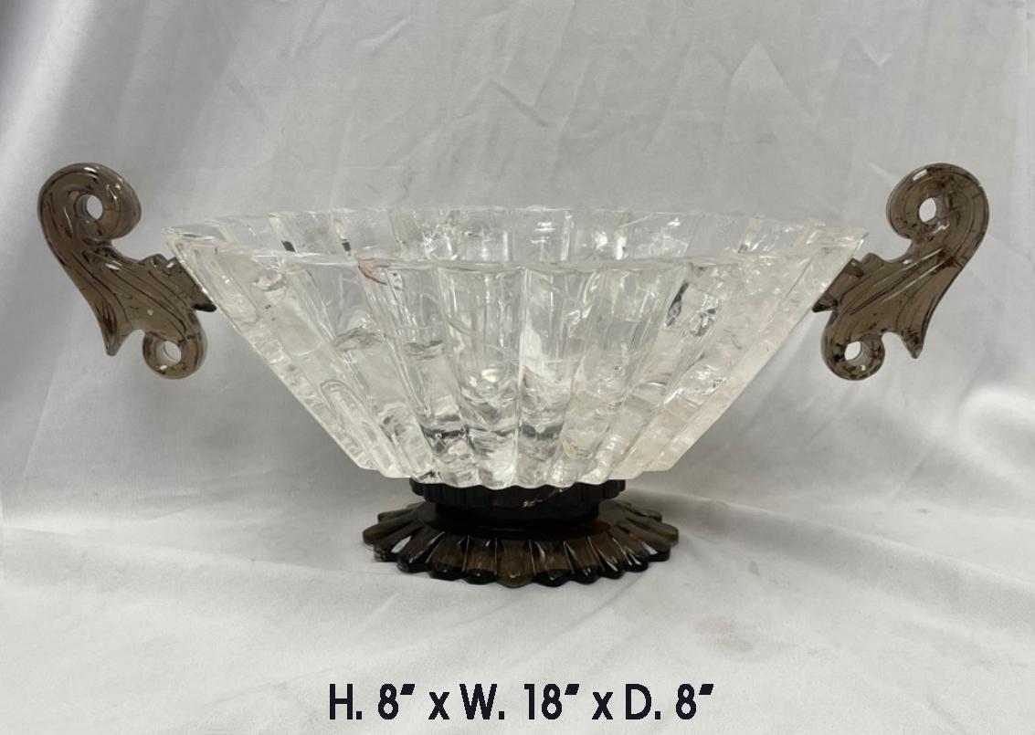 Magnificent on of a kind hand carved rock crystal and smokey rock crystal scalloped center piece in a form of an oval bowl, with carved handle on each side. Excellent quality quartz has used.
Meticulous attention has been given to every detail.