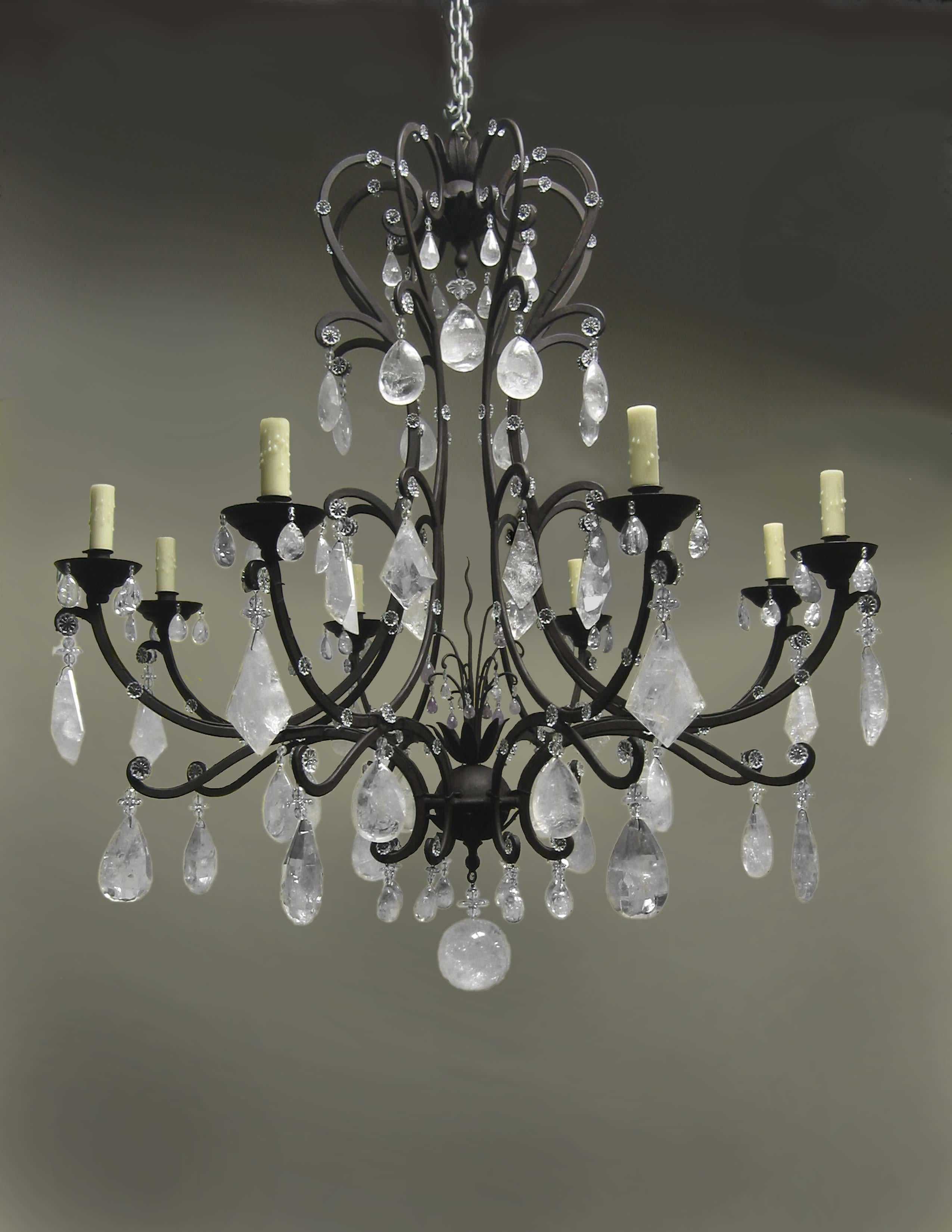 A beautiful rock crystal and wrought iron Genoese chandelier
hand-carved and polished rock crystal prisms mounted on a hand-forged wrought iron chandelier frame. (Antique black finish)
With handmade beeswax candle sleeves.
Includes a matching