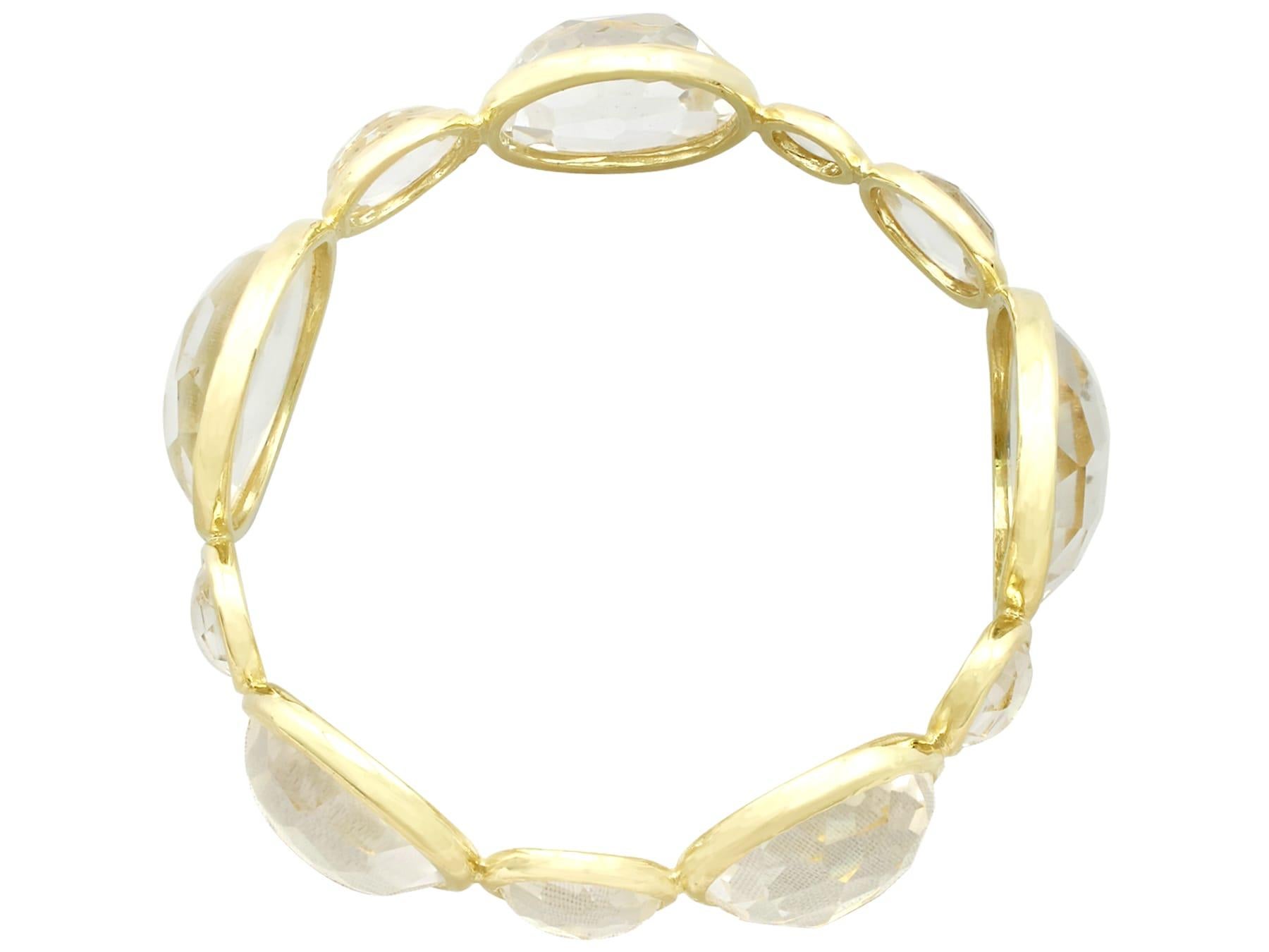 An impressive rock crystal and 18k yellow gold bangle by Ippolita; part of our diverse gemstone jewelry and estate jewelry collections.

This fine and impressive rock crystal bangle has been crafted in 18k yellow gold.

The substantial bangle is