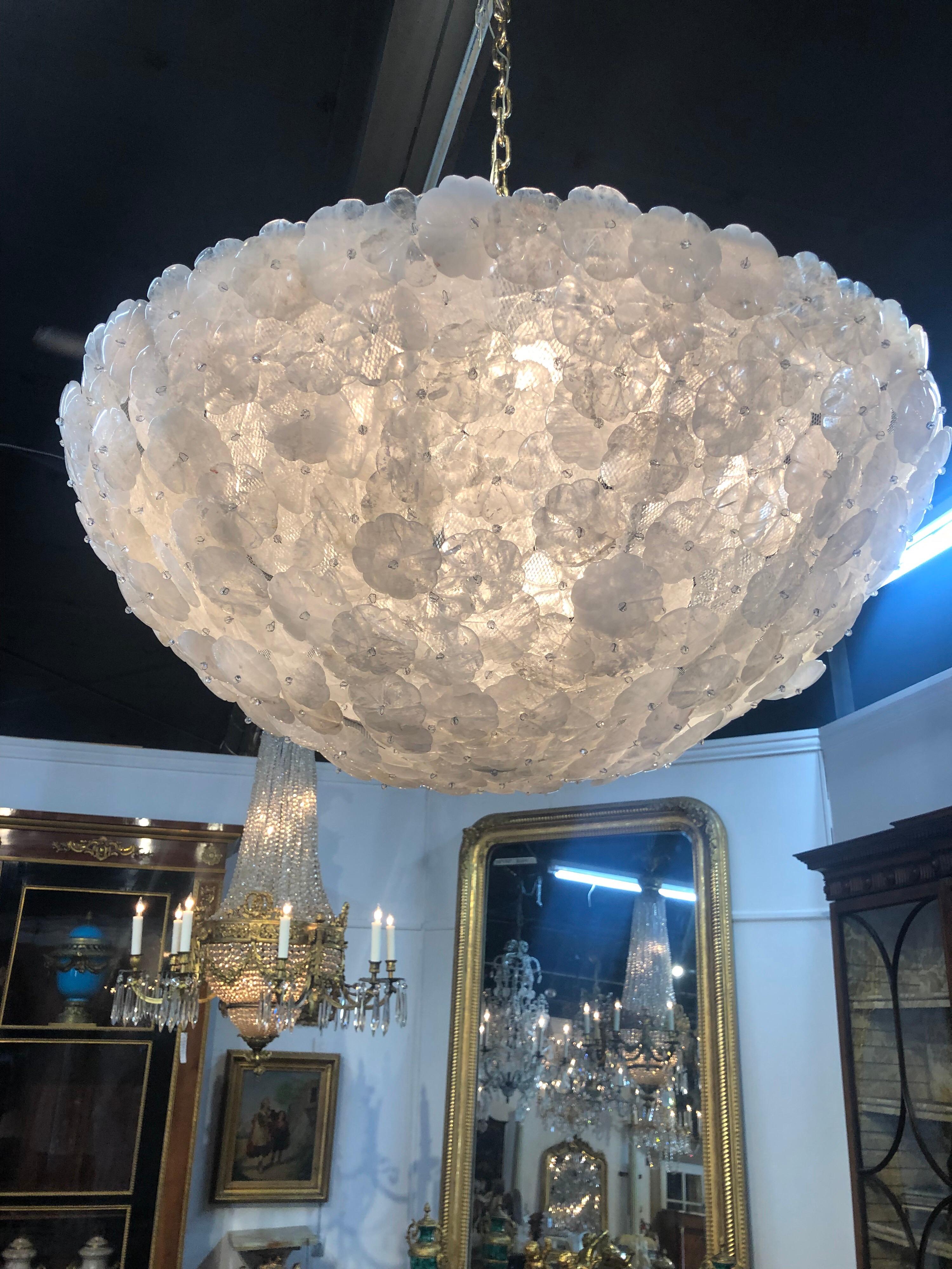 Fabulous custom rock crystal chandelier made by Legacy. Beautiful flowers attached to a dome shape. This unique chandelier really makes a statement. Decorative chain and canopy are included in the price. Custom sizes available.