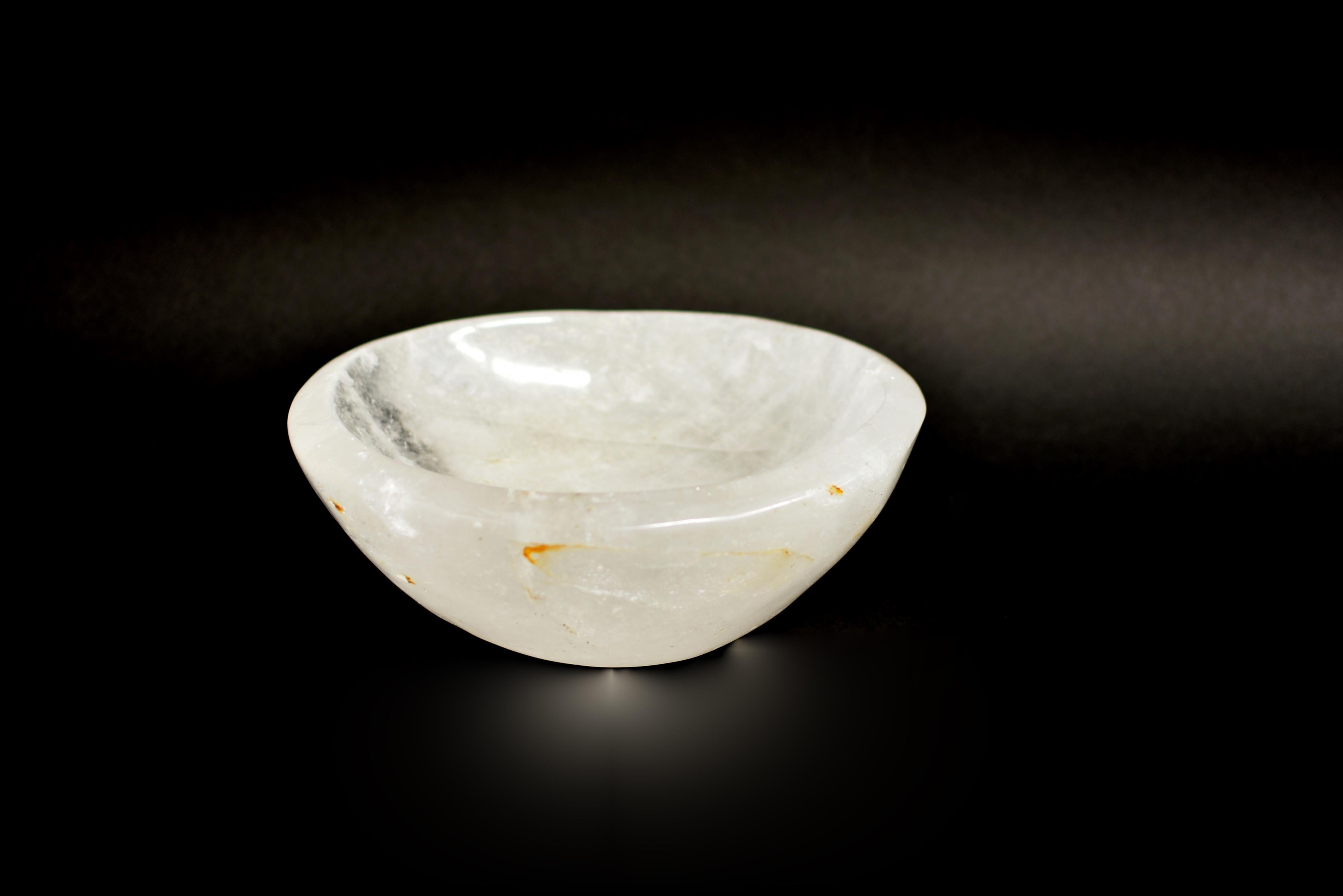 A beautiful all natural rock crystal bowl, hand carved and polished. Fine AAA gemstone grade genuine rock crystal with rare gold rutile. Of organic form with beautiful translucency and iridescence. A stunning objet d'art for interior design and