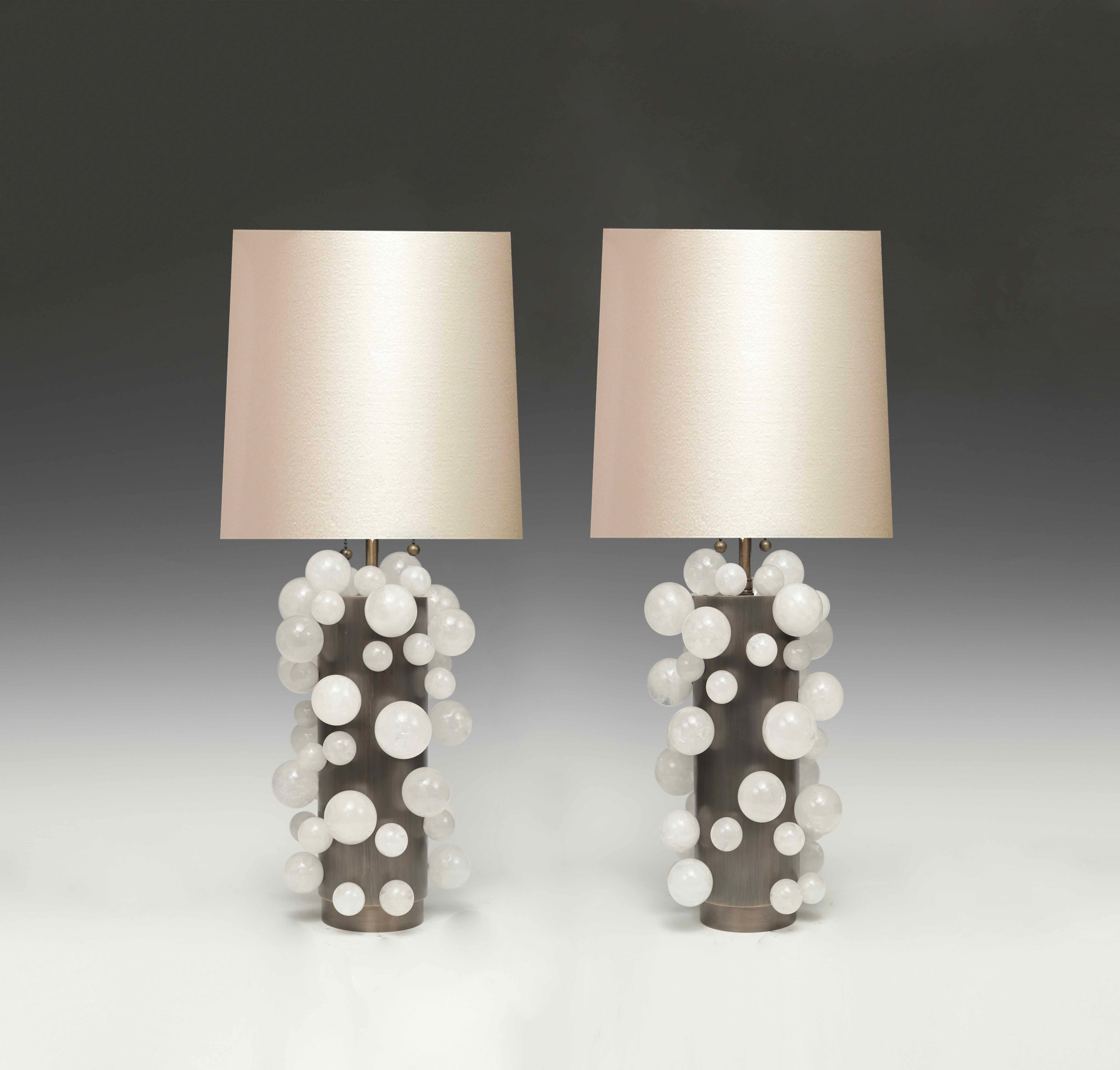 A pair of luxury white rock crystal quartz bulb lamps with antique brass bases, created by Phoenix Gallery, NYC.
Each lamp installed two sockets.

Lampshade not included.