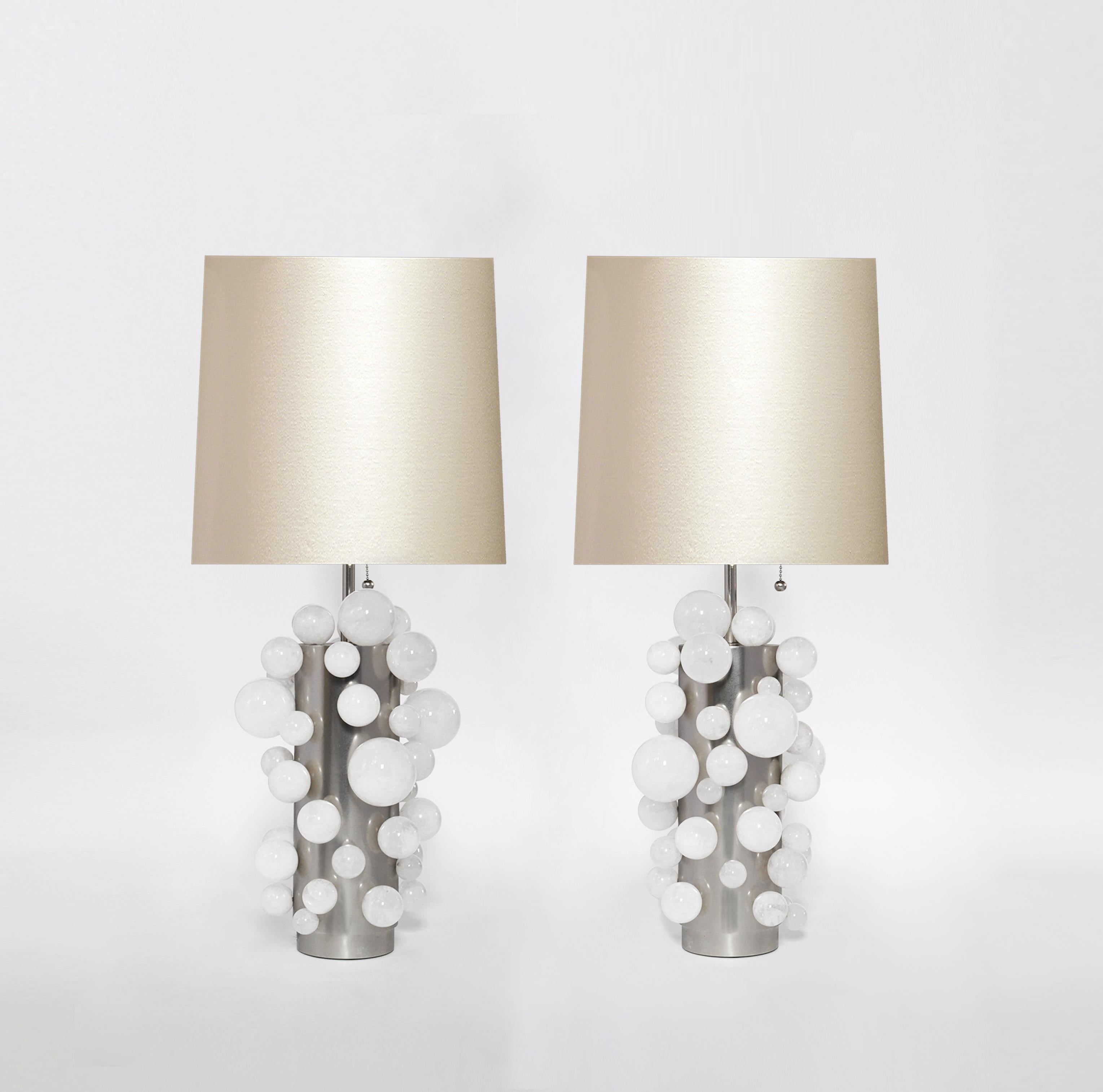 A pair of luxury white rock crystal quartz bulb lamps with matte nickel bases. Created by Phoenix Gallery, NYC.
To the top of the rock crystal 13.25 inch.
Lampshade not included.
