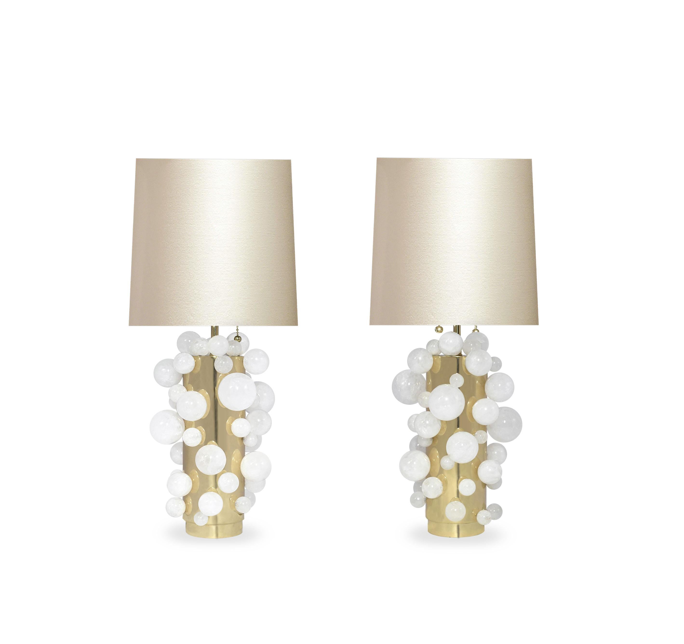 A pair of luxury white rock crystal quartz bulb lamps with polished brass bases. Created by Phoenix Gallery, NYC.
To the top of rock crystal bubbles: 13
