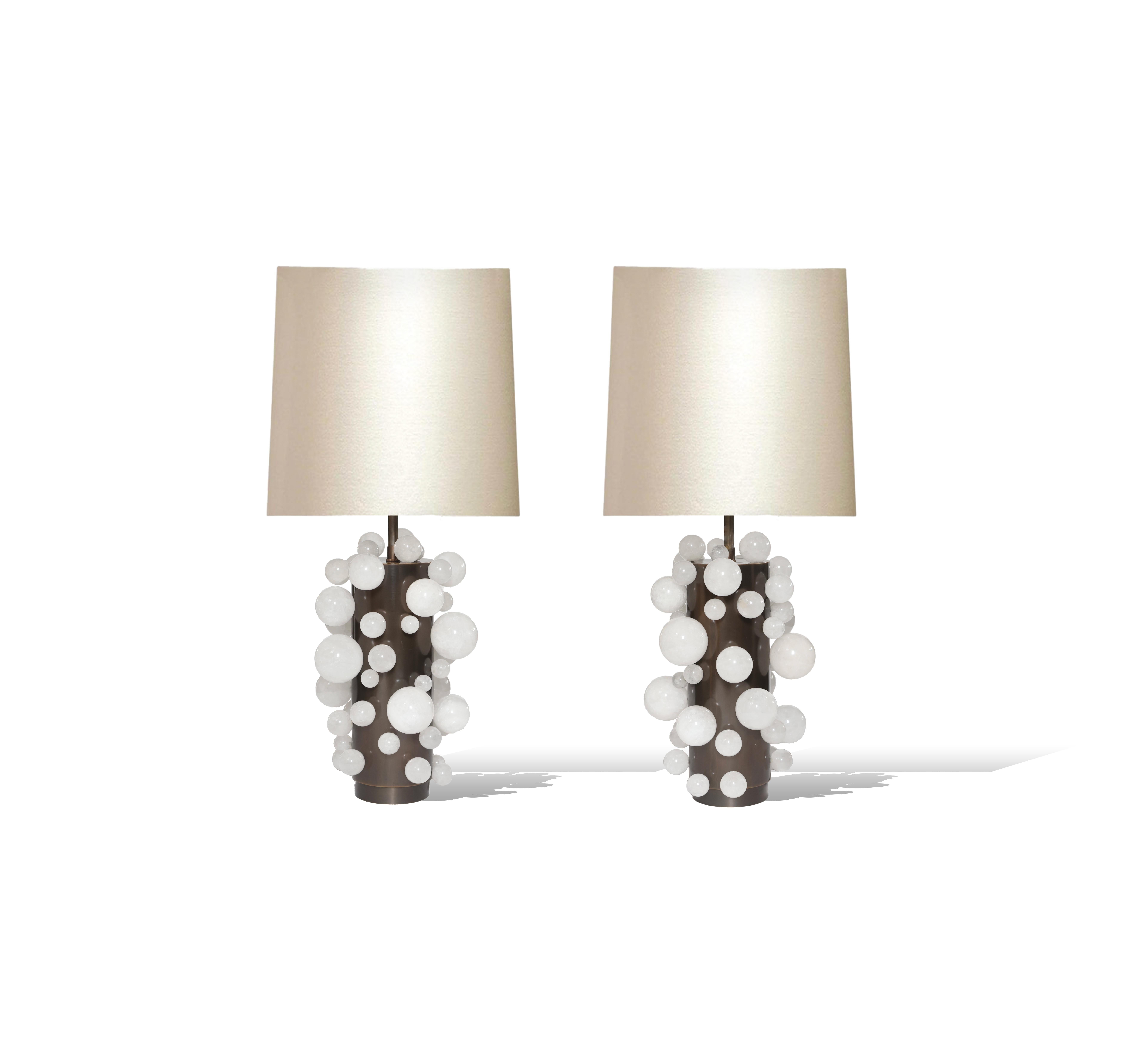 A pair of luxury white rock crystal quartz bulb lamps with antique brass bases, created by Phoenix Gallery, NYC.
Each lamp installed two sockets.
Lampshades not included.