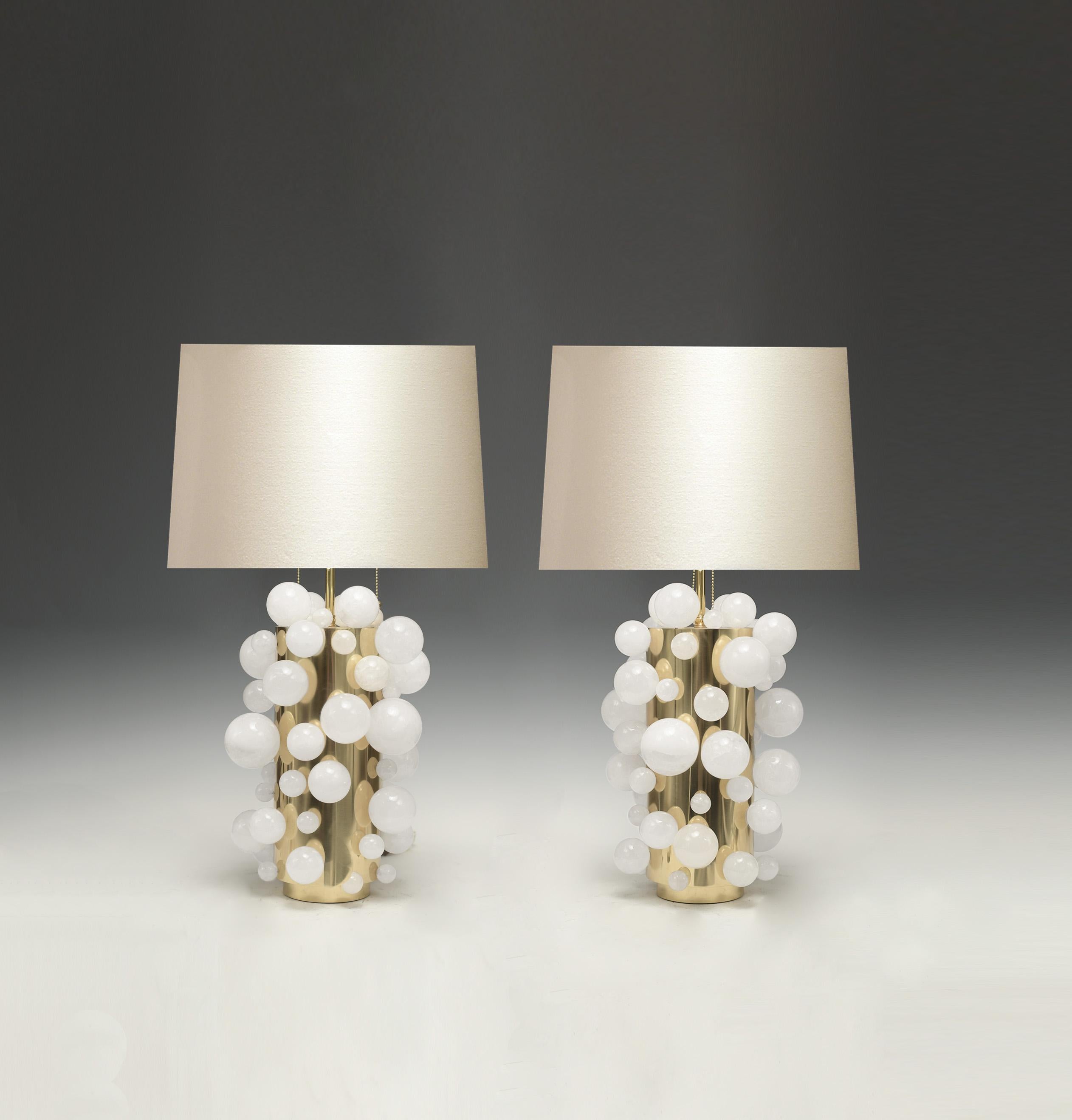 A pair of luxury white rock crystal quartz bulb lamps with polished brass bases, created by Phoenix Gallery, NYC.
Each lamp installed two sockets.
To the top of the rock crystal 17 inch.
Lampshade not included.