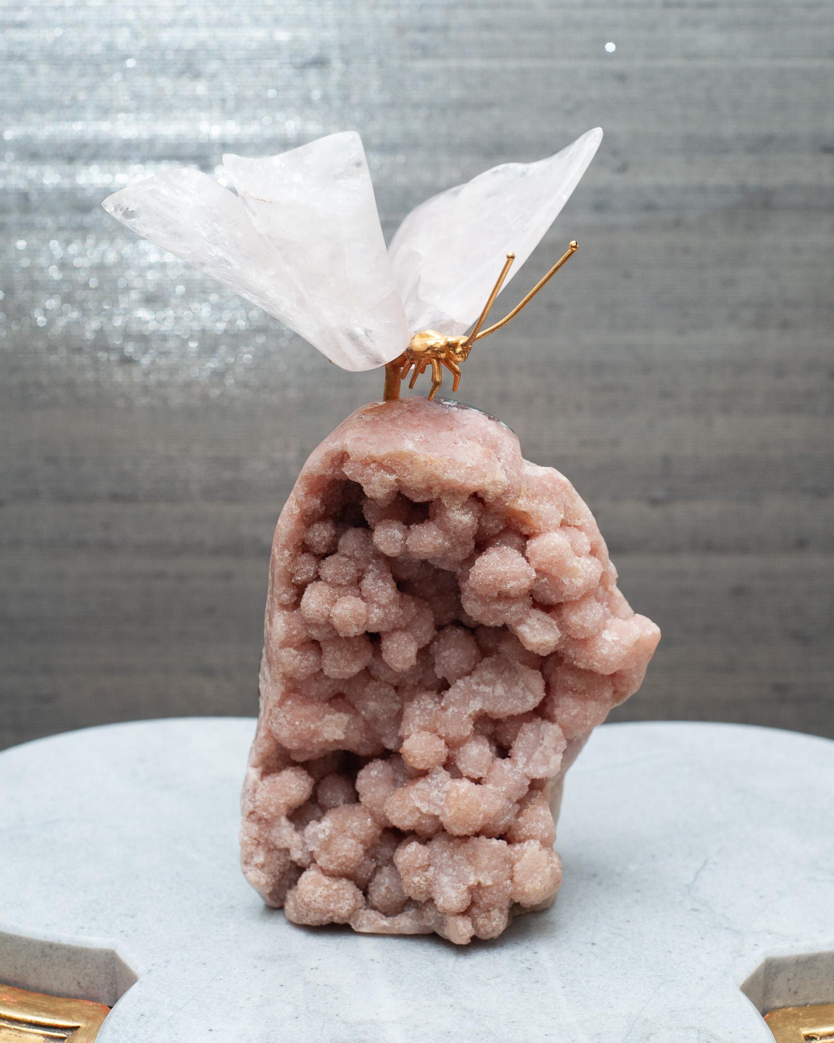 A stunning decorative mineral specimen, composed of a rock crystal butterfly with brass body, on a pink geode base. A beautiful accessory for any table top while inviting the healing energy of crystals into ones home. 