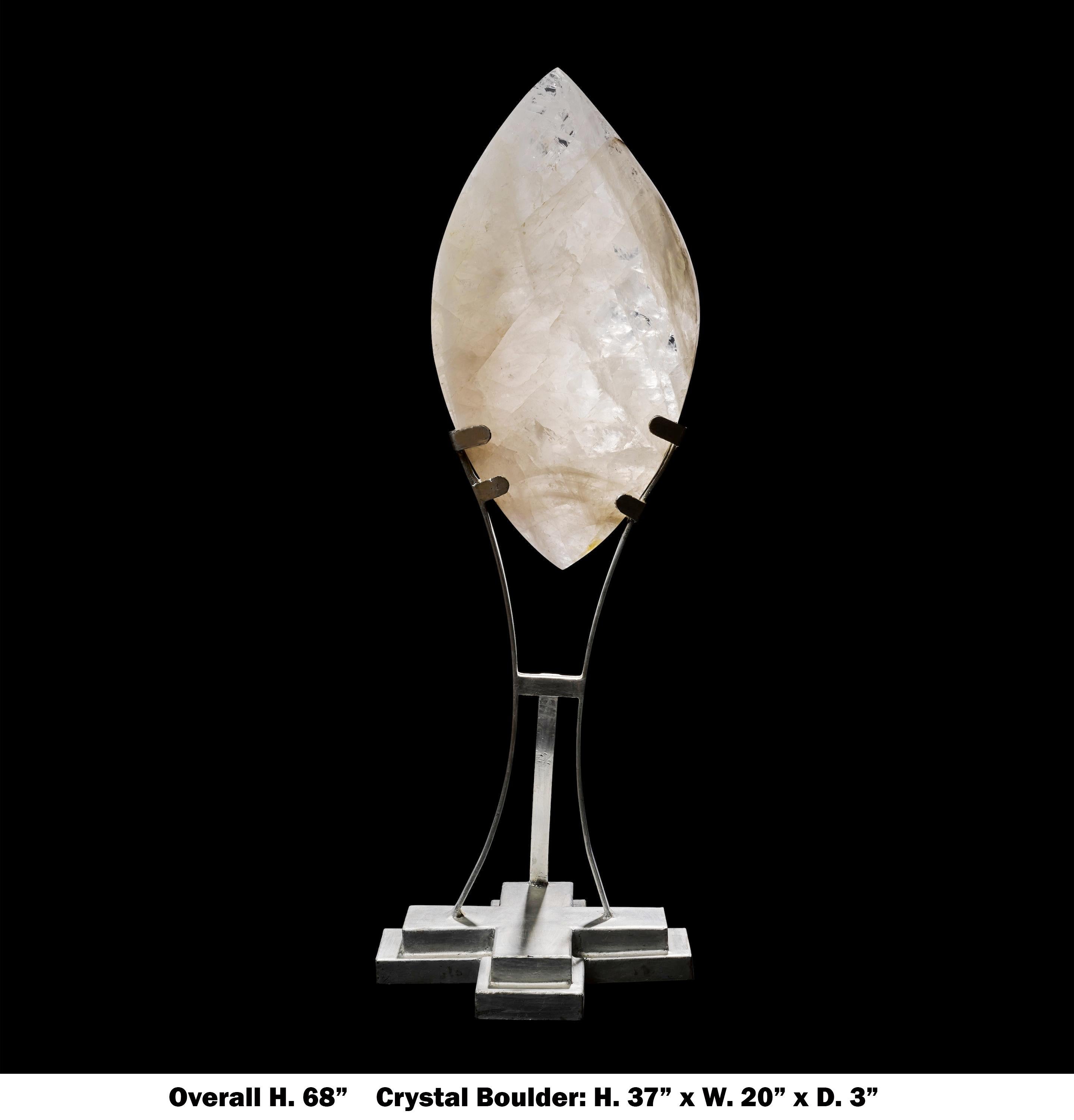 Impressive monumental carved rock crystal Quartz sculpture with custom stand
monumental sculpture of leaf-form, carved from a single large boulder of rock crystal quartz, with sufficient transparency to transmit light. Beautifully displayed on a