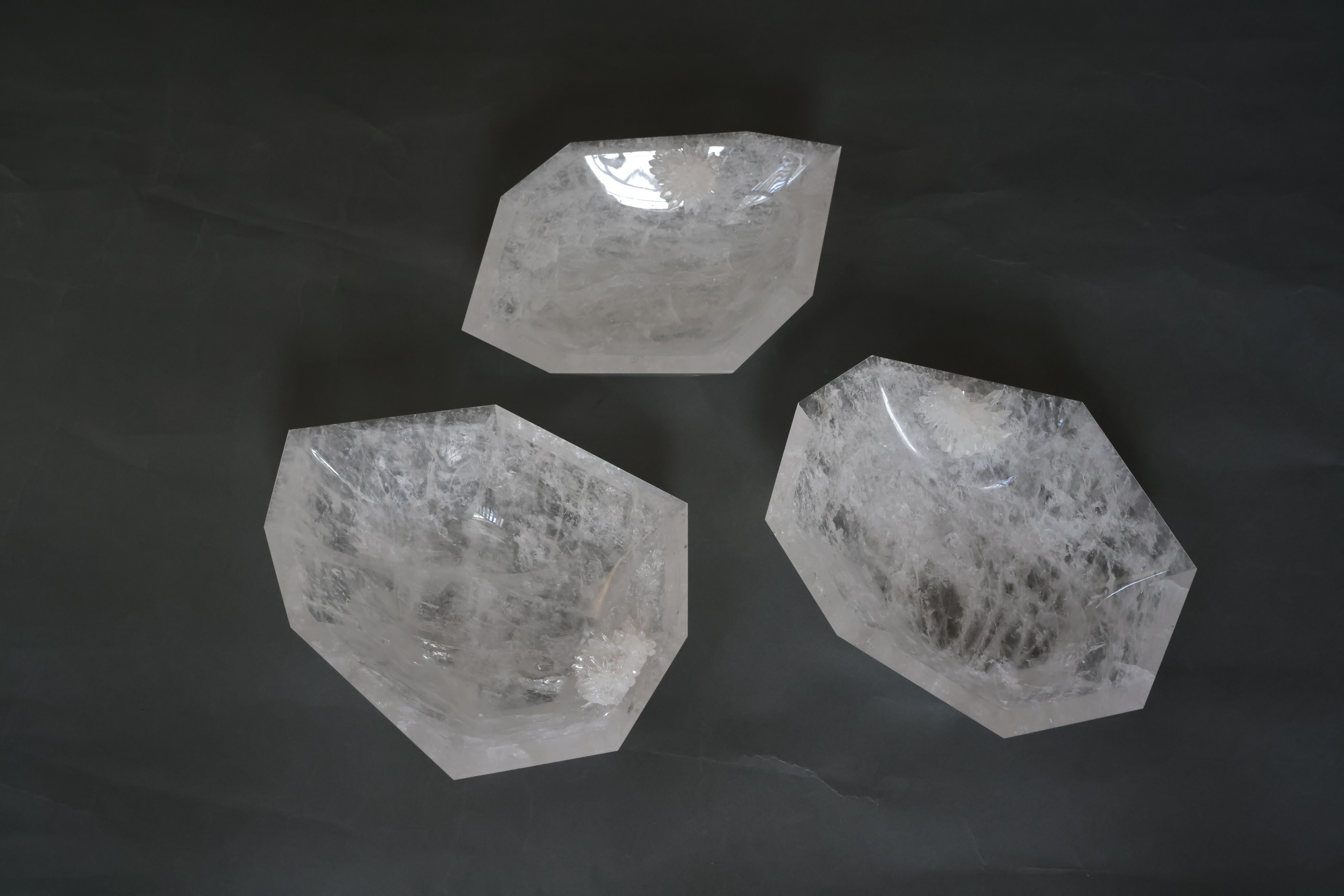 Group of three geometric form rock crystal centerpieces
With clusters decorations. Carved from billions years old natural Quartz crystal. Created by Phoenix gallery
Measures: 13”x 9.5”x 3.25. 
12.25”x9.75”x3.25”
12.5” x 9.5” x 3.25”.
 