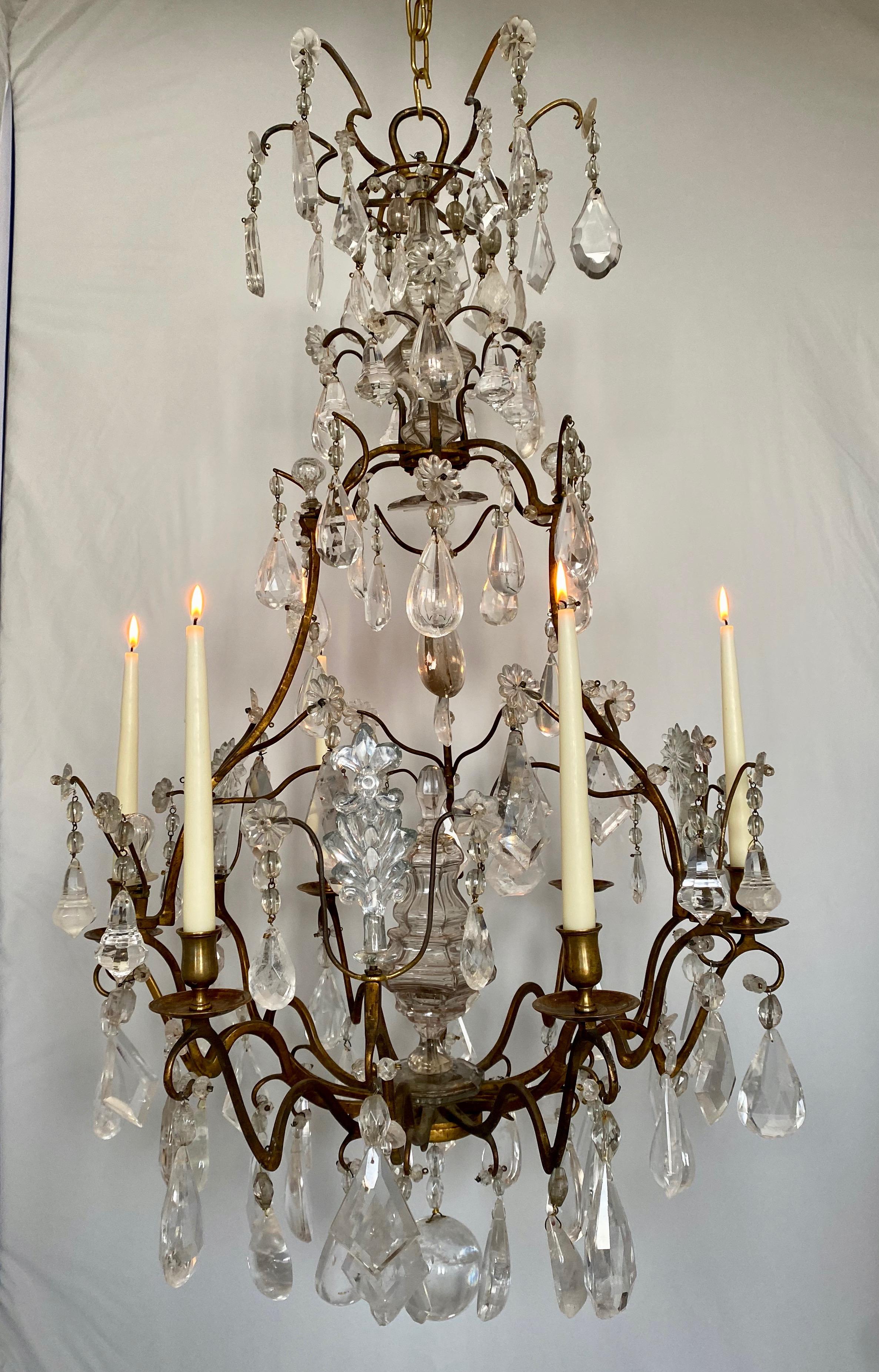 A good looking French chandelier. Pendants of rock crystal and the central parts of blown 18th c glass. Very good patina and fine design. Will look great anywhere.