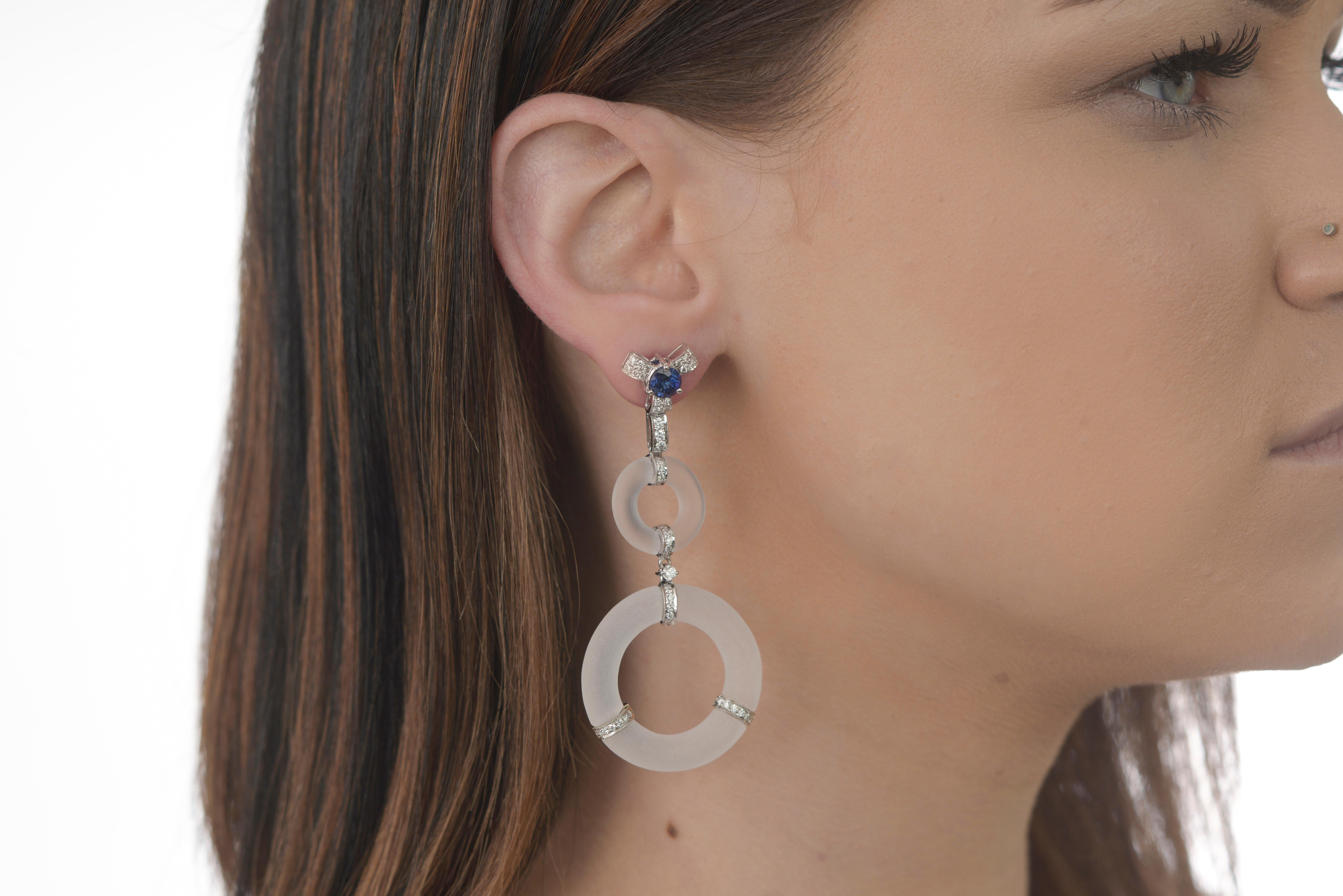 Ornate details and colorful gems create a stunning display of artistry in Ri Noor's Rock Crystal Circles Blue Sapphire and Diamond Earrings. The earrings mix shapes and materials in a unique way which makes a special statement that elevates any
