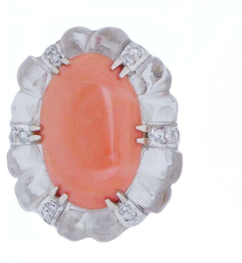 Earrings in 14 kt white gold structure mounted with a central coral in a crown of diamonds and rock crystal.
These earrings were totally handmade by Italian master goldsmiths and they are in perfect conditions.
Diamonds 0.33 ct
Coral 1.30 gr
Rock