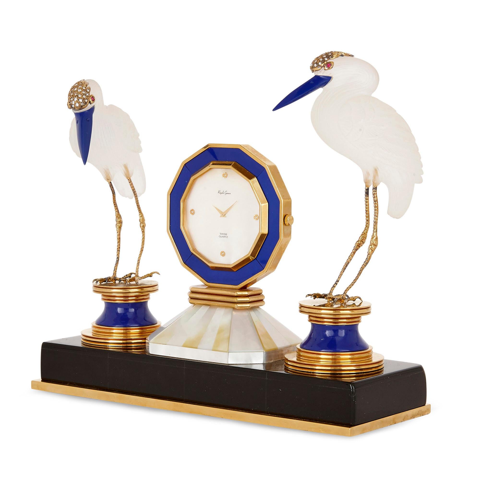 Crafted from the very best of materials, including black onyx, lapis lazuli, rock crystal, diamonds, and rubies, this table clock by the Swiss maker Royale Geneve is materially splendid—it is also charming in its form, including as it does twin