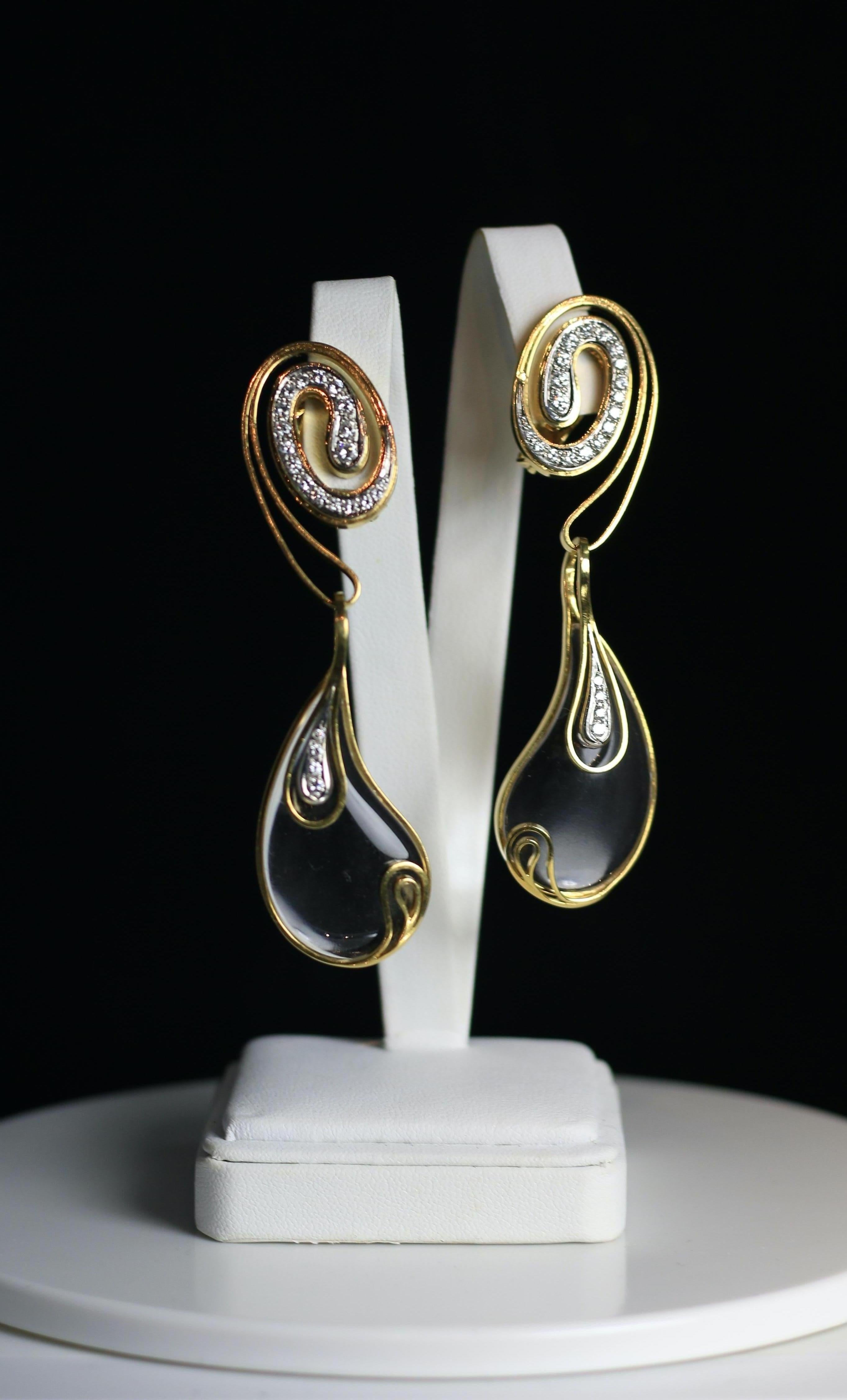 Fabulous Lalounis 18K yellow gold and Diamond with Quartz Crystal completely fabulous Earrings.  Dangle Drops will make a big statement! Swirling Ecstasy Design with Diamonds in a teardrop shape. 
