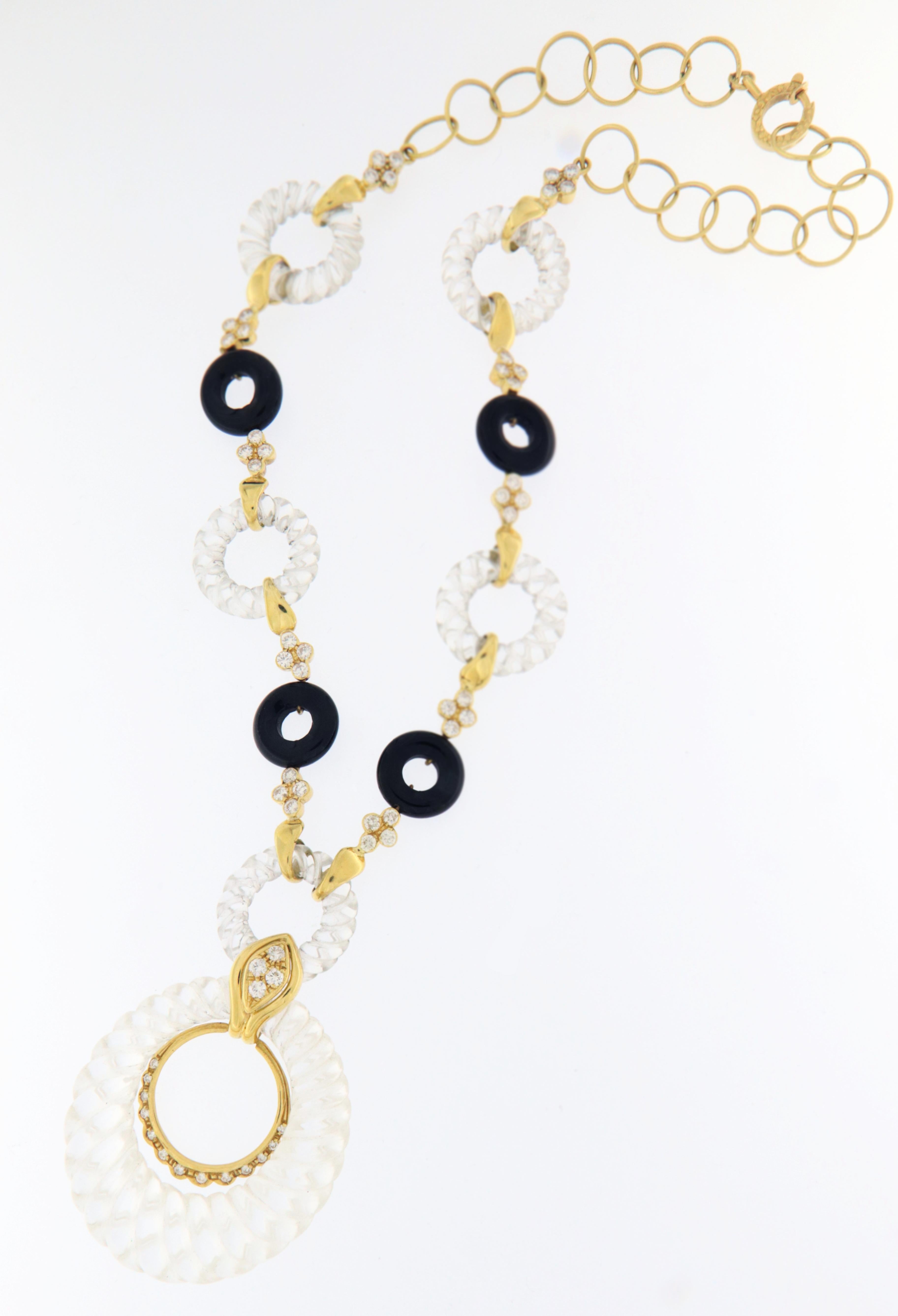 Beautiful 18 karat yellow gold pendant necklace.Handmade by our craftsmen assembled with rock crystal diamonds and onyx

Diamonds weight 3.74 karat
Necklace total weight 59.60 grams
Necklace length 45 cm