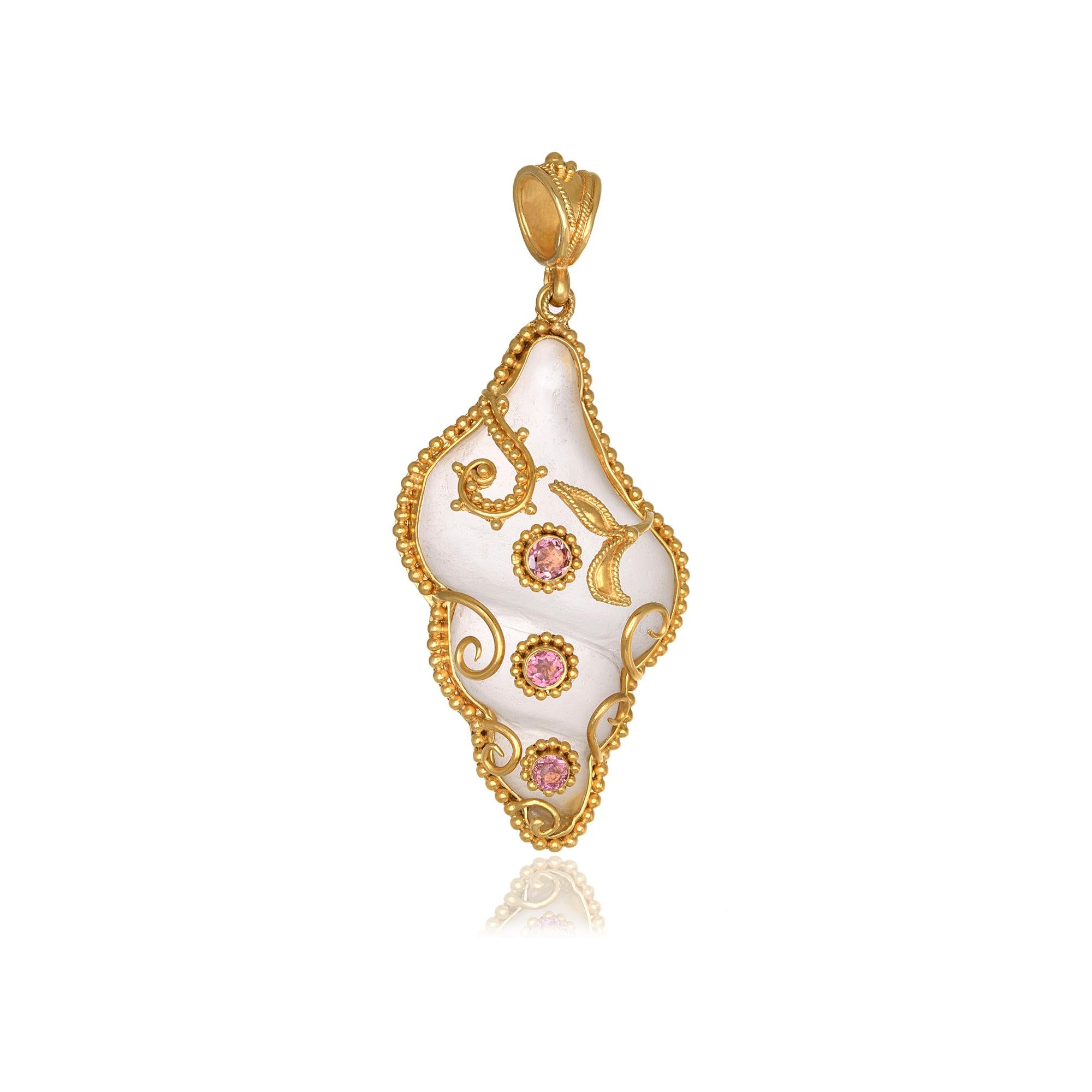 Shell Shape carved rock crystal Pendant necklace, handcrafted in 22Kt yellow gold, featuring round Tourmalines. This breathtaking jewelry piece is braided according to the ancestral techniques of granulation and filigree. The delicate and intricate