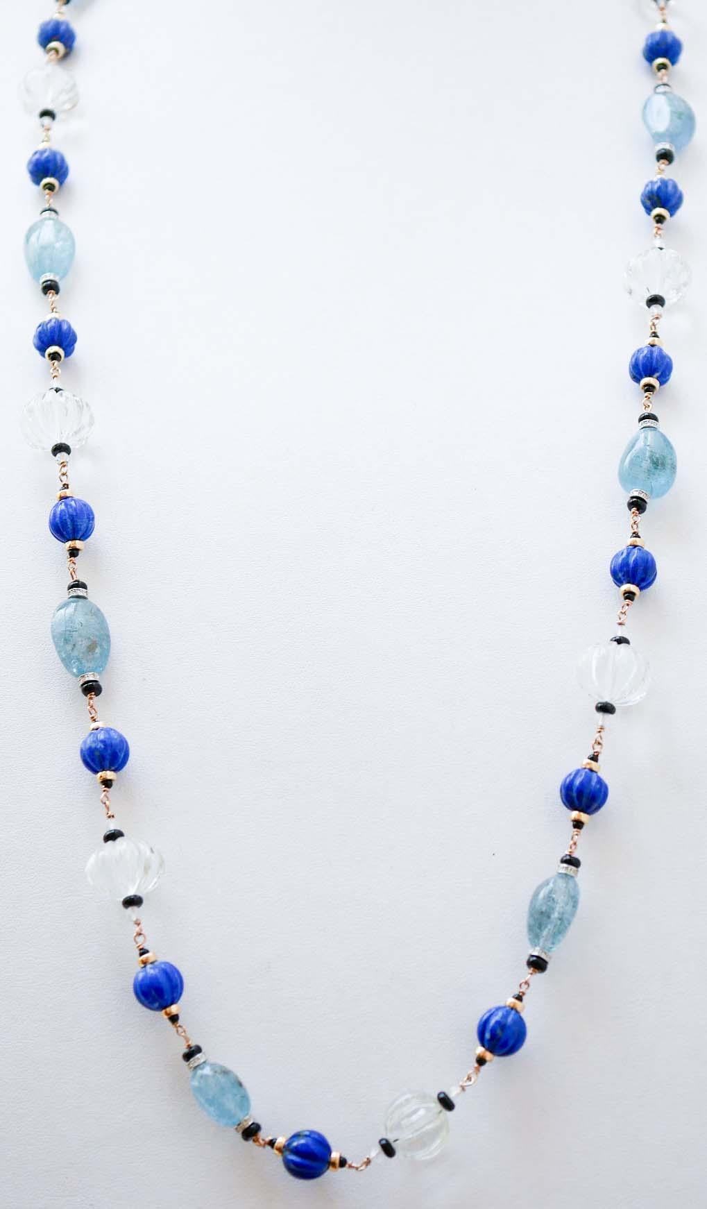 Beautiful necklace in 9 kt rose gold structure mounted with sections of lapis, rock crystal, aquamarine, onyx and structures in 9 kt white gold with diamonds. Between of them, little structure in 14 kt rose gold.
This necklace was totally handmade
