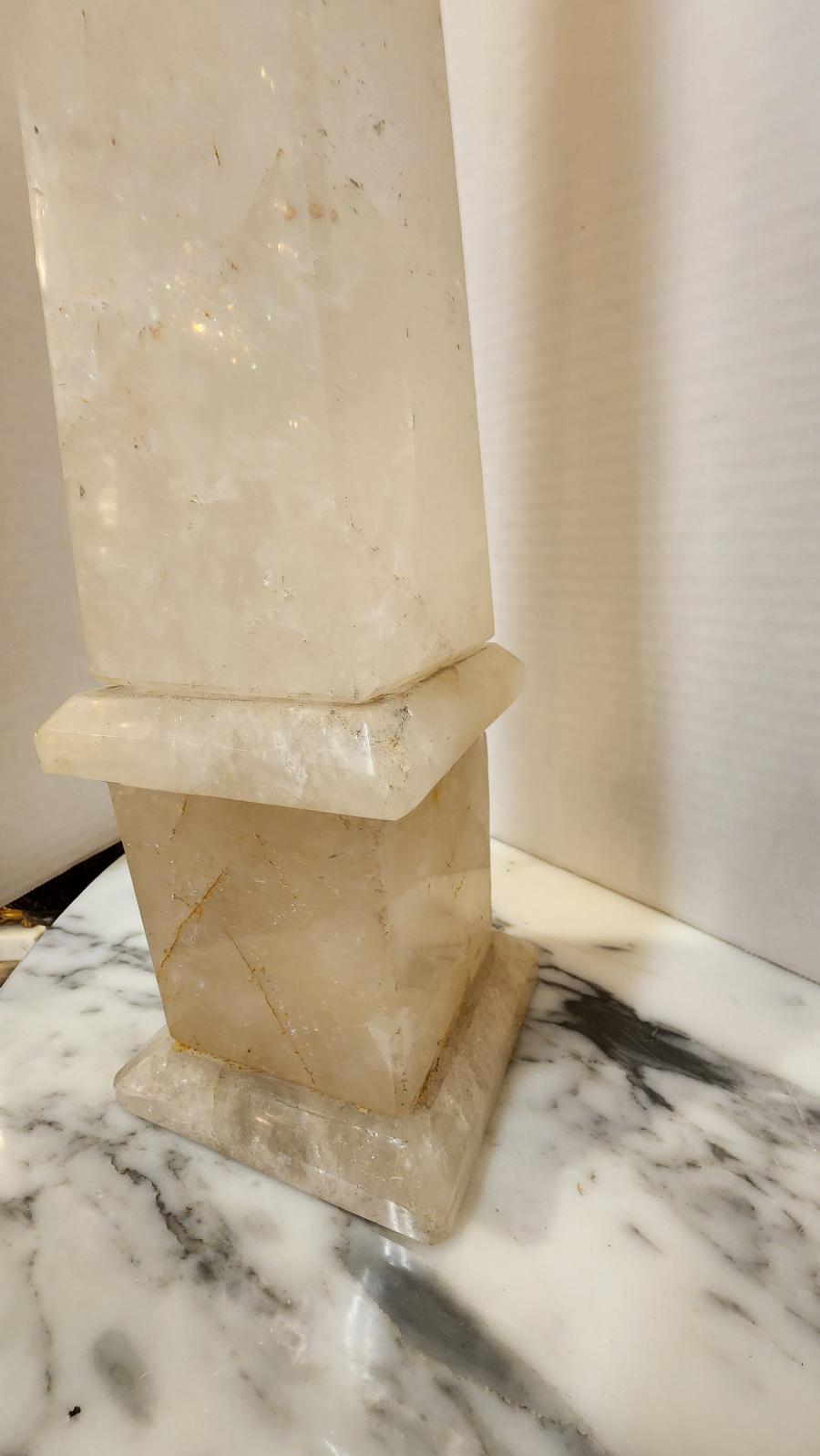 This listing features a hand polished and carved Rock Crystal Obelisk that most likely originated from Europe. This versatile accent can be displayed on a table, mantle or bookshelf. 