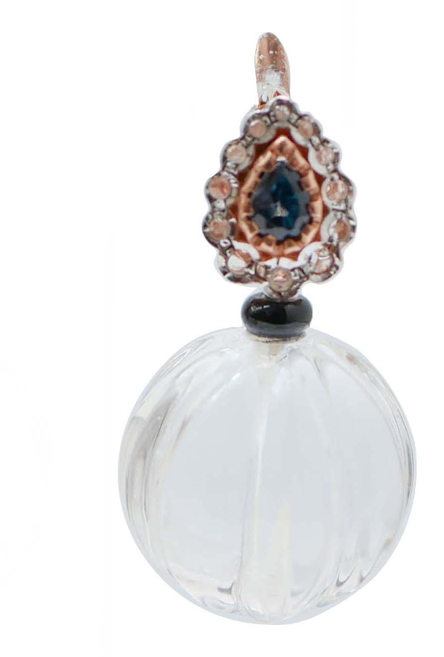 Amazing earrings in 9 kt rose gold and silver structure mounted with a drop sapphire surrounded by diamonds in the upper part. In the middle, an onyx and, below, a rock crystal.
These earrings were totally handmade by Italian master goldsmiths and