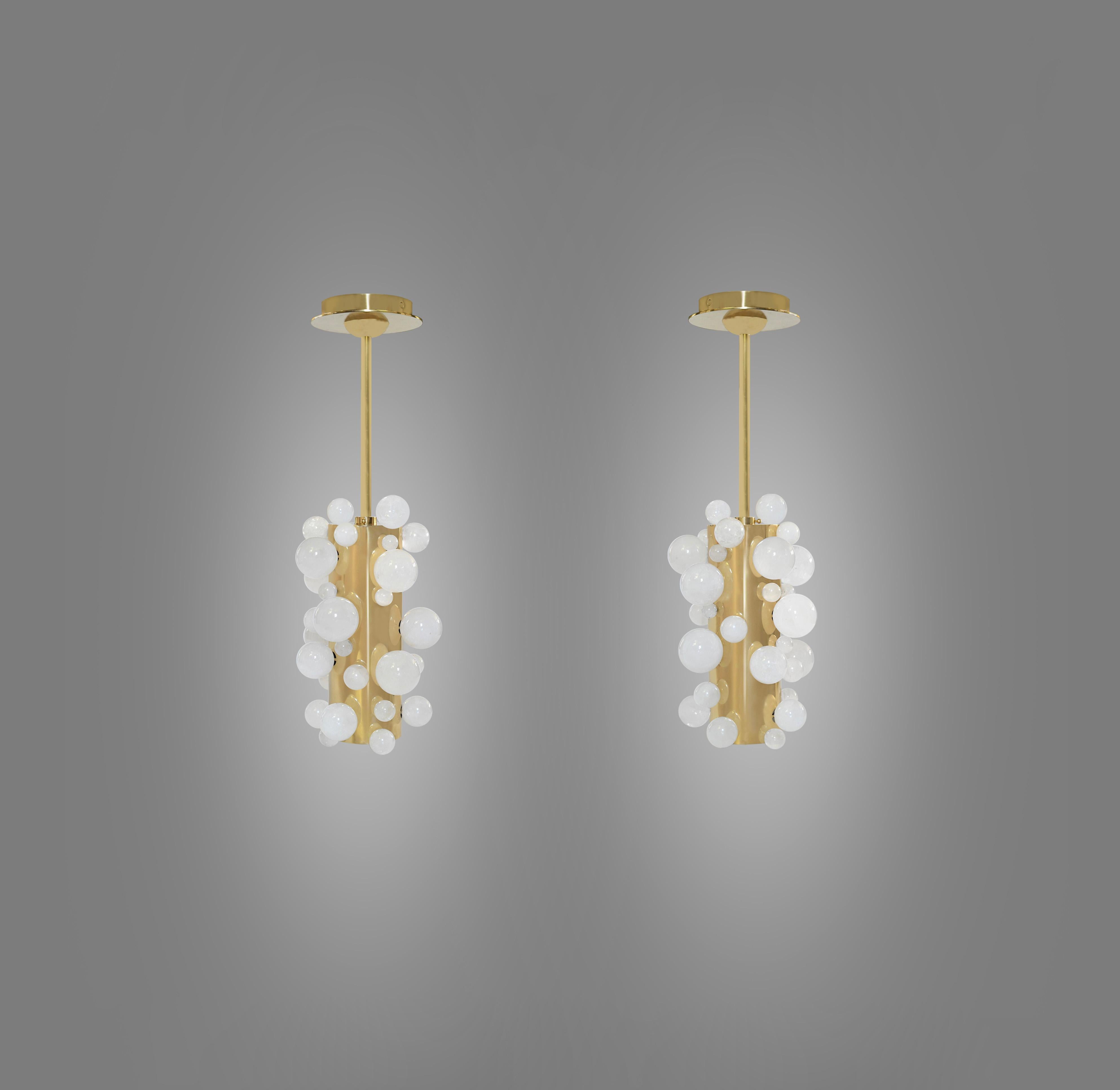 Pair of rock crystal bubble pendant lights with polished brass finishes. Created by Phoenix Gallery, NYC.
Two sockets installed. Use LED warm light bulbs. 50w each. 100 w total.
Dimension of the pendant: 8