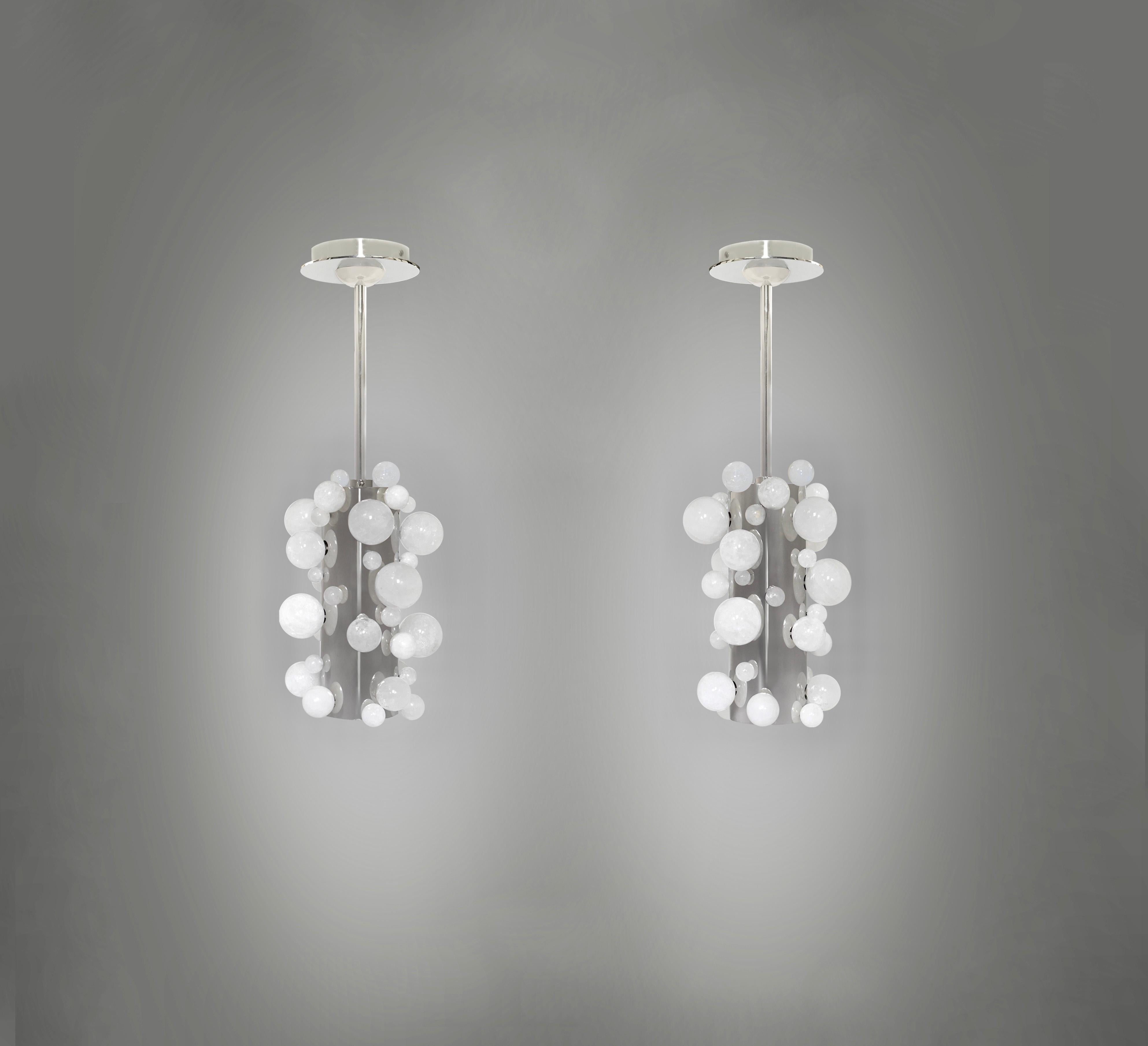 Pair of rock crystal bubble pendant lights with nickel plating finishes. Created by Phoenix Gallery, NYC.
Two sockets installed. Use LED warm light bulbs. 50w each. 100 w total.
Dimension of the pendant: 8