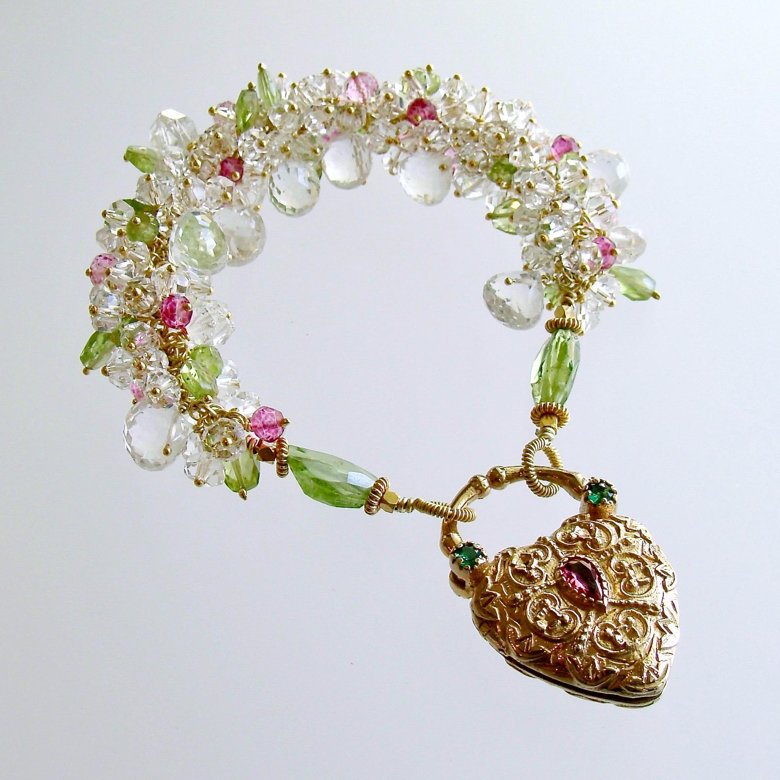 Luxurious clusters of sparkling rock crystal, Herkimer diamonds, peridot and pink topaz have been hand-linked into this magnificent cluster bracelet featuring the always popular colors of Spring green and pink.  The laborious cluster portion of the