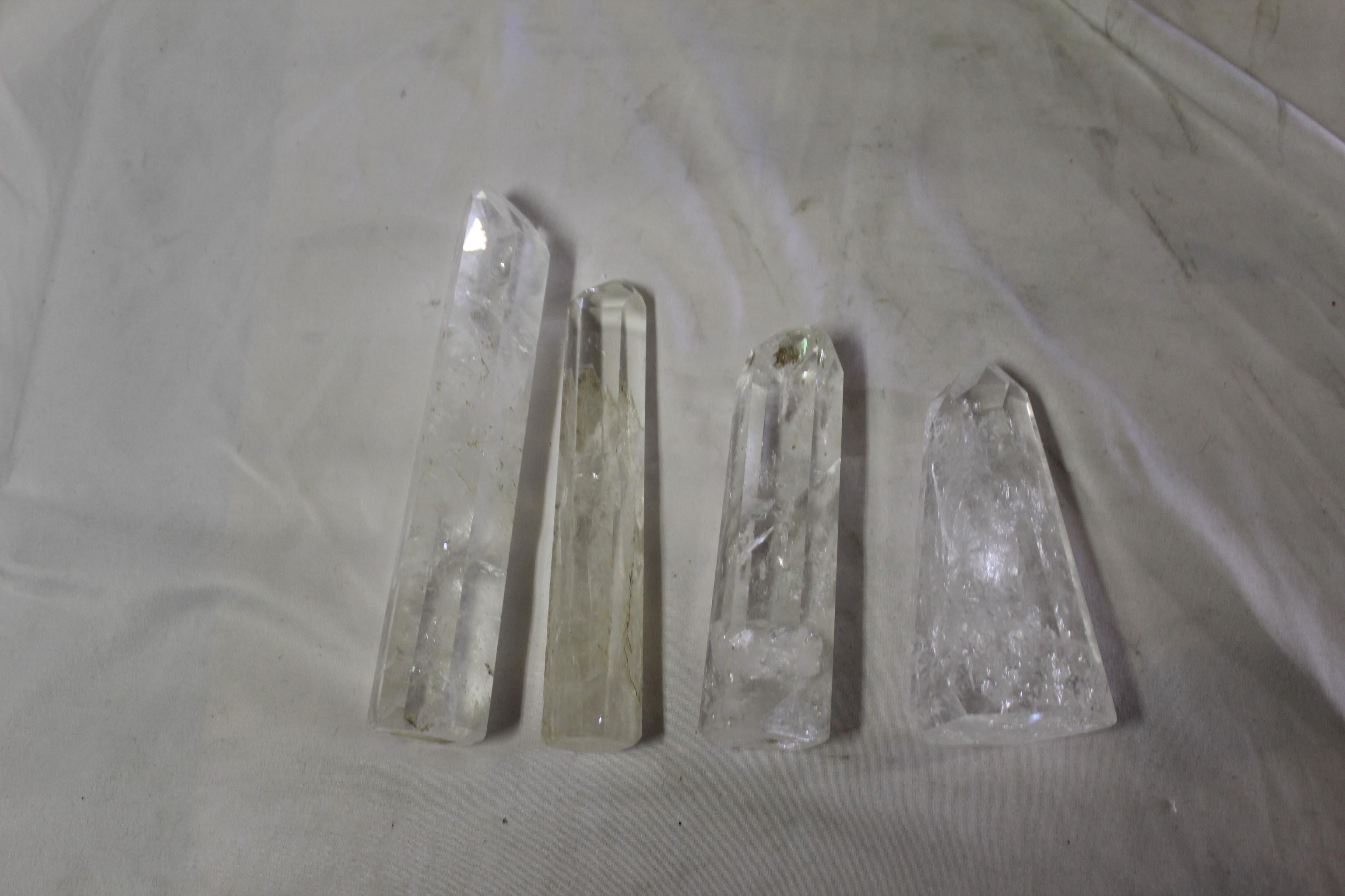 Hi-grade quartz crystal points from Brazil. Used for decorations or some believe in good luck and good health. Measures: Various sizes from 4