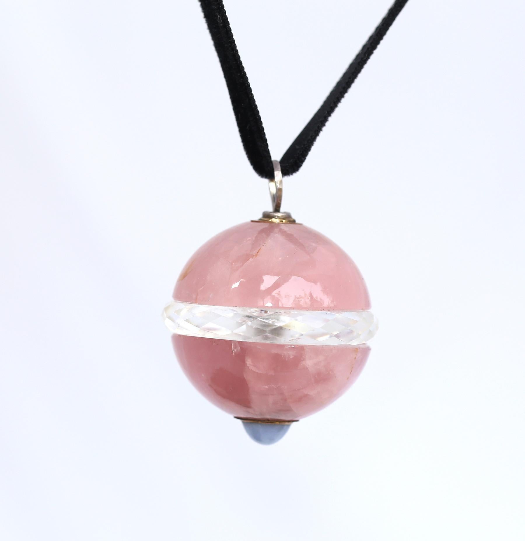 Rock Crystal Rose Quartz Sapphire Pendant, 1900
A massive Pendant, Rock Crystal layer is held between the Rose Quartz halves with a cabochon Sapphire in the bottom. 1900 Stylish antique items represent the sustainable trend in fashion, when