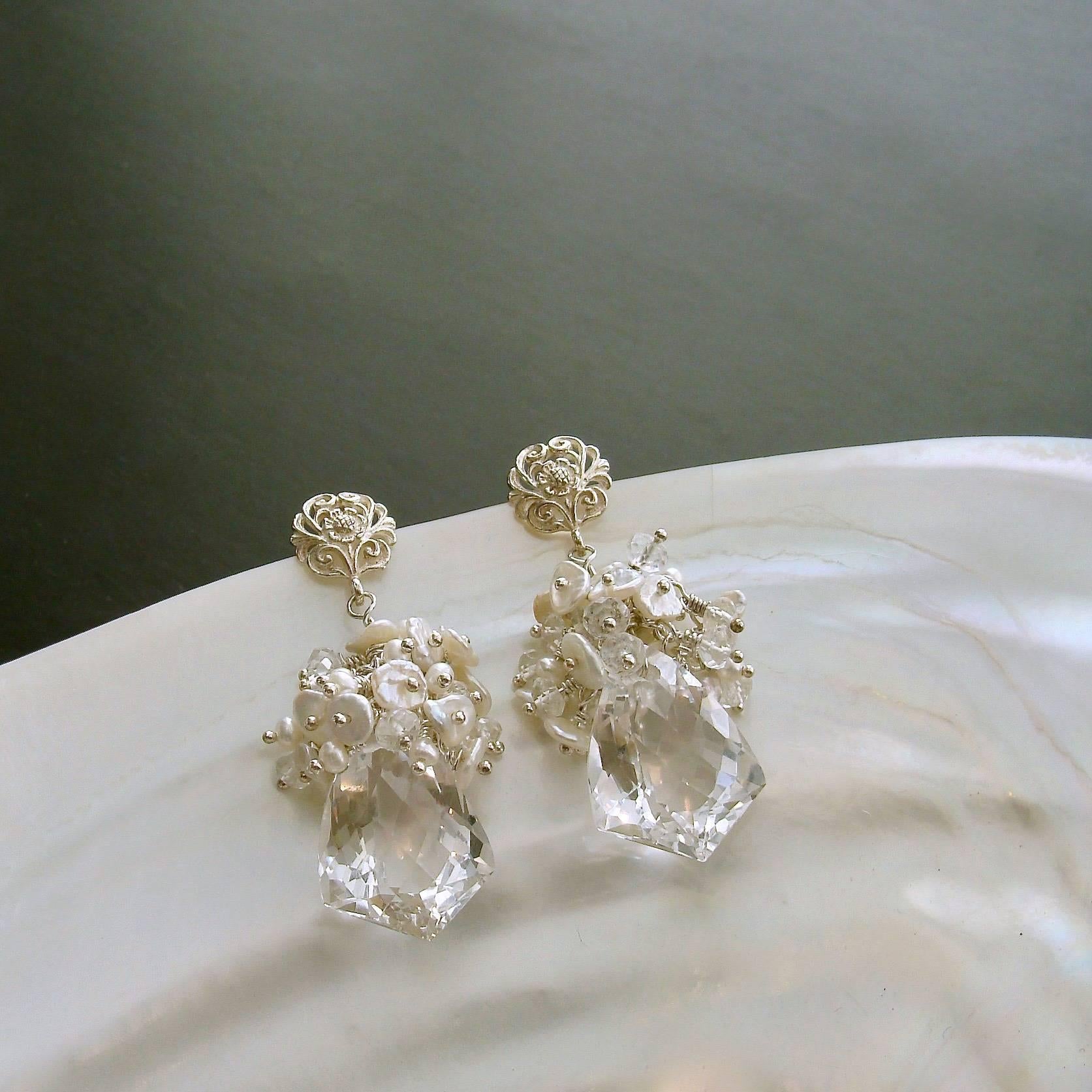 Orange Blossom II Earrings.

A gorgeous bridal earring design, inspired by the coveted perfumed flowers of orange trees, is aptly named Orange Blossom II Earrings.  A profusion of creamy ivory freshwater seed pearls and miniature Keshi petal pearls