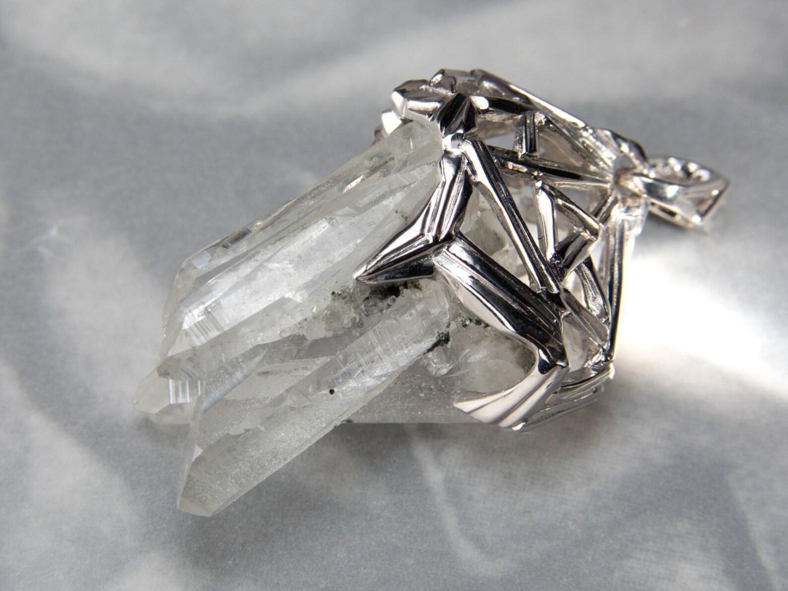 Silver pendant with natural Crystals Cluster of Rock Crystal
rock crystal origin - Brazil
crystals weight - 38 carats
crystals measurements - 0.79 х 1.22 in / 20 х 31 mm
pendant weight - 13.64 grams
pendant height - 1.77 in / 45 mm