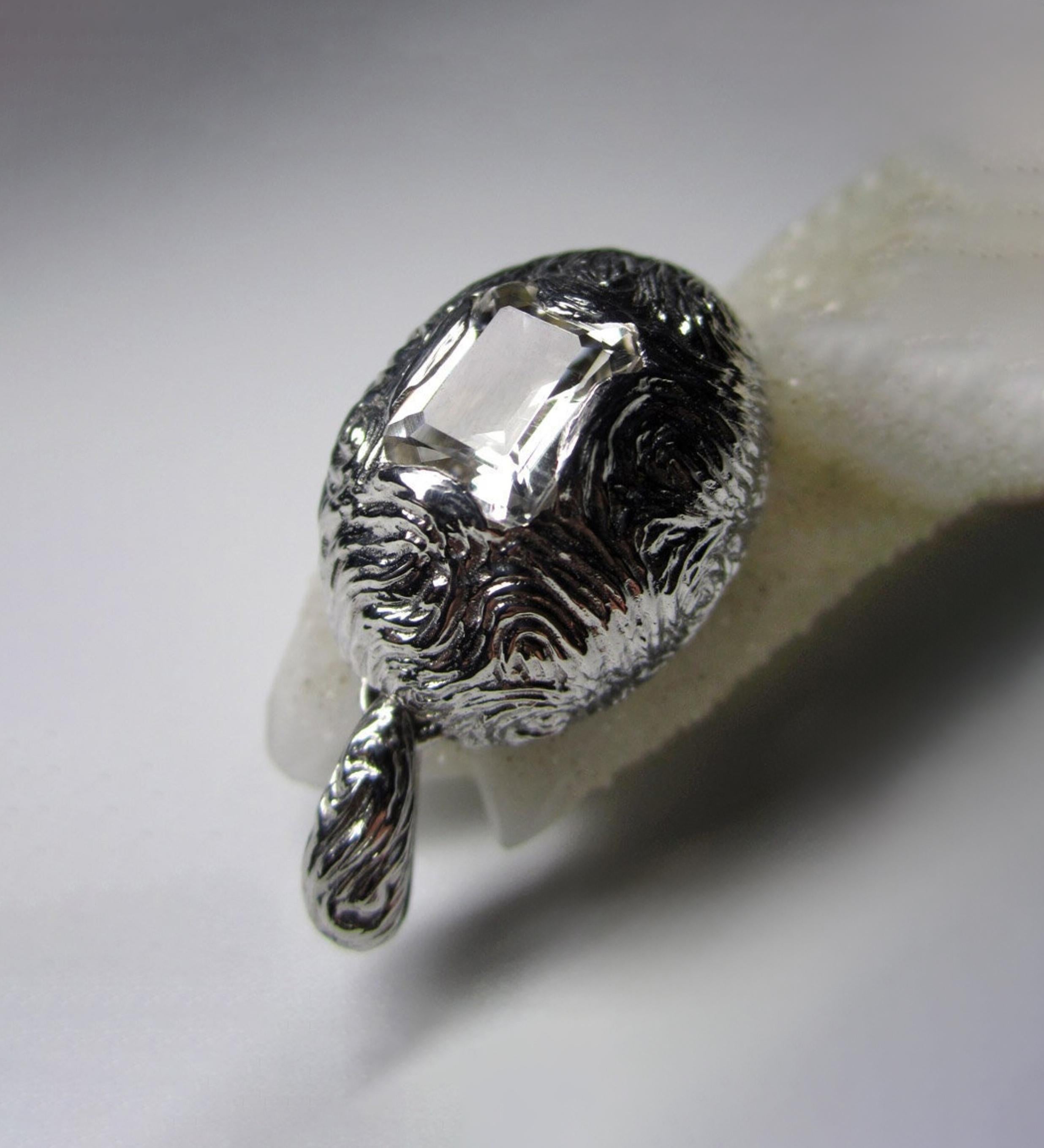 Silver pendant with natural Quartz Rock Crystal in octagon-cut
stone origin - Brazil
stone measurements -  0.16 х 0.28 х 0.35 in / 4 х 7 х 9 mm
weight of the stone - 2 ct
weight of the pendant - 8 grams
pendant height - 1.38 in / 35 mm