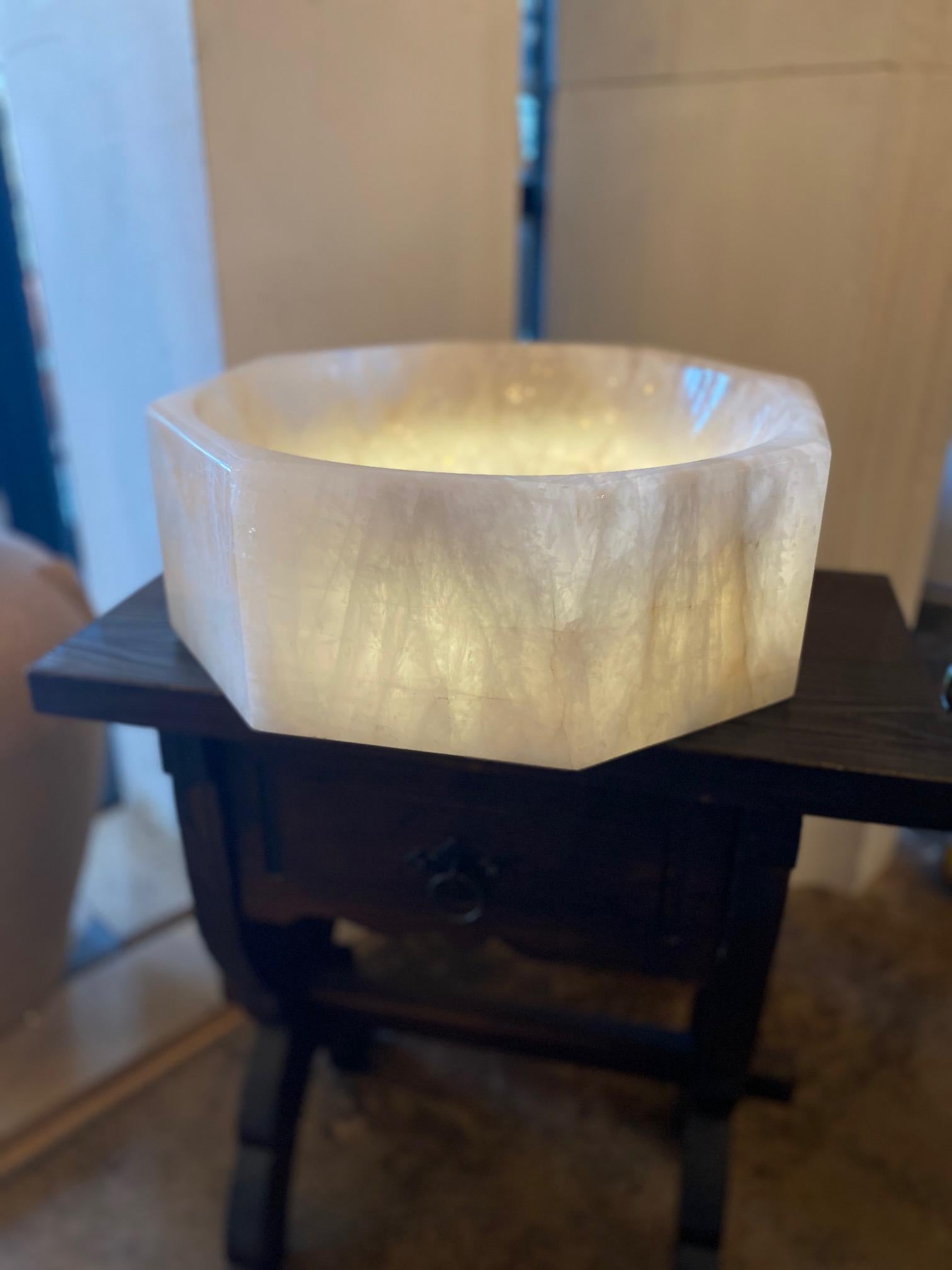 This rock crystal sink is a rare find. Pictured here with light on and off, with possibility to sync with bathroom/interior light, sure to impress guests. Made in South America, contemporary.

Measurements: 15.5