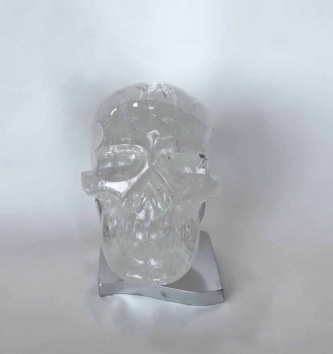 Sublime rock crystal skull with stainless steel stand. Made in Brazil.
 
Dimensions: 
 
With stand:8 ½