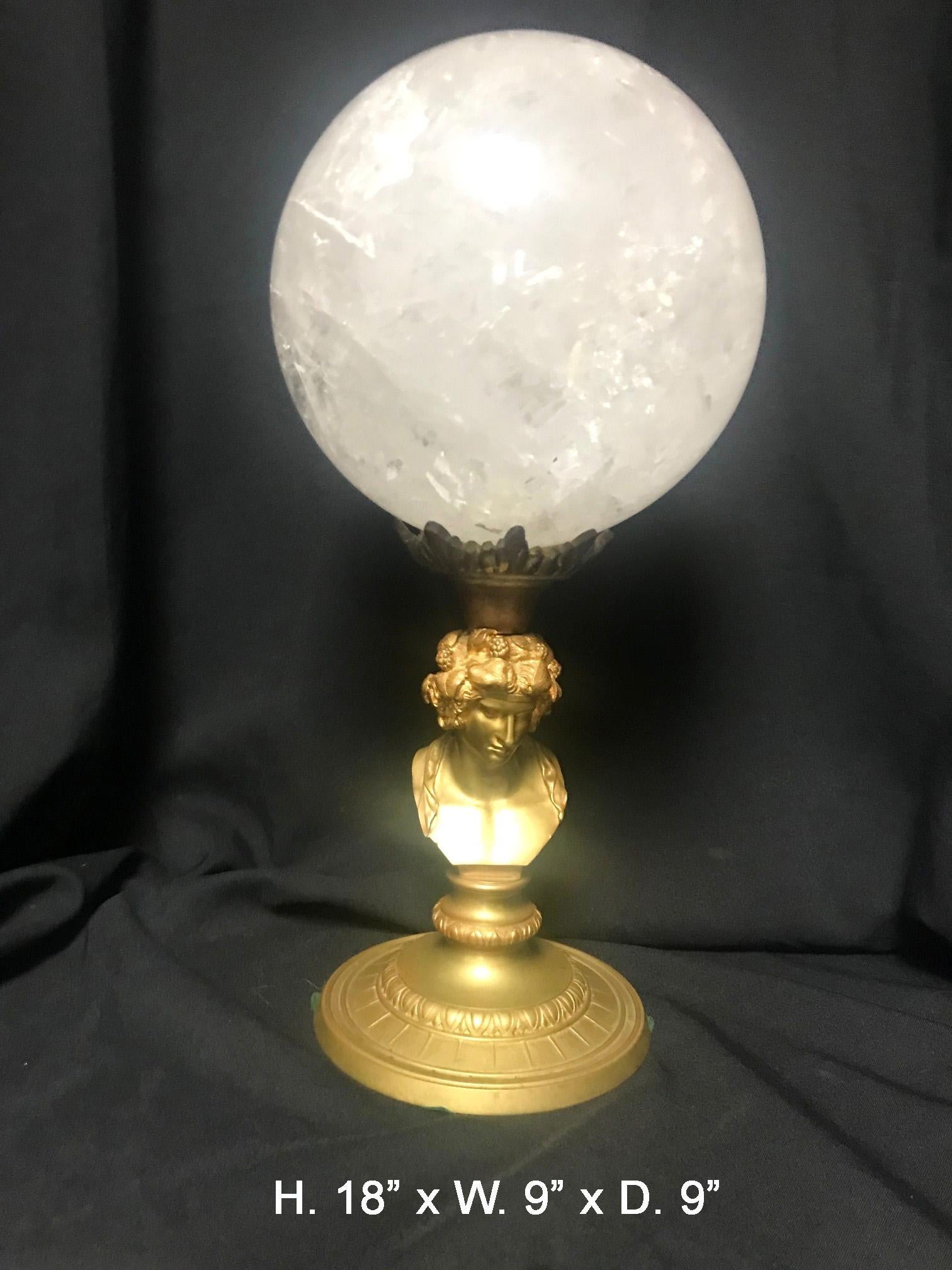 Beautiful quality large rock crystal sphere on gilt bronze base depicting a intricate male bust.