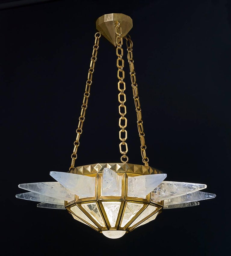 Rock crystal quartz sunshine light, customized gold edition. Original model design by Alexandre Vossion and made since, 2014. The fixture, chains and canopy of this rock crystal chandelier are handmade in bronze in Paris. Workers who made this model