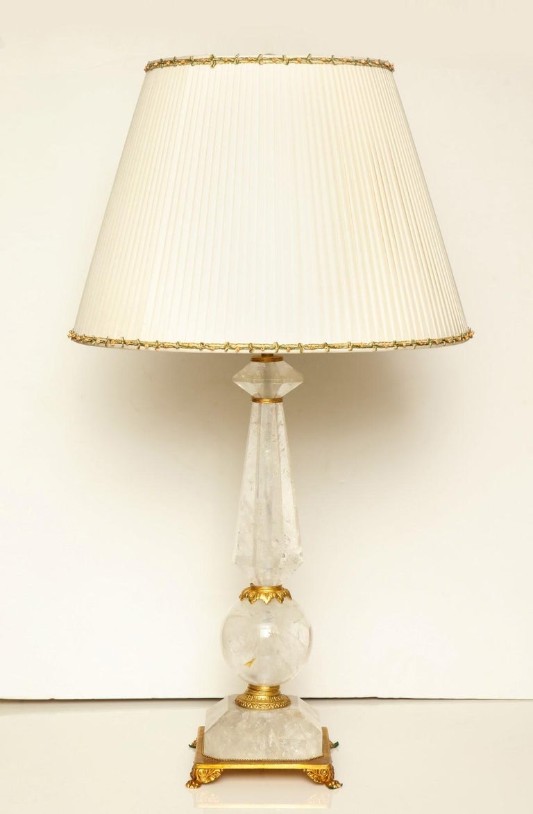 A pair of rock crystal table lamps, giltwood elements, wired for electricity, and fitted with two Edison sockets each, maximum wattage per socket: 100W.