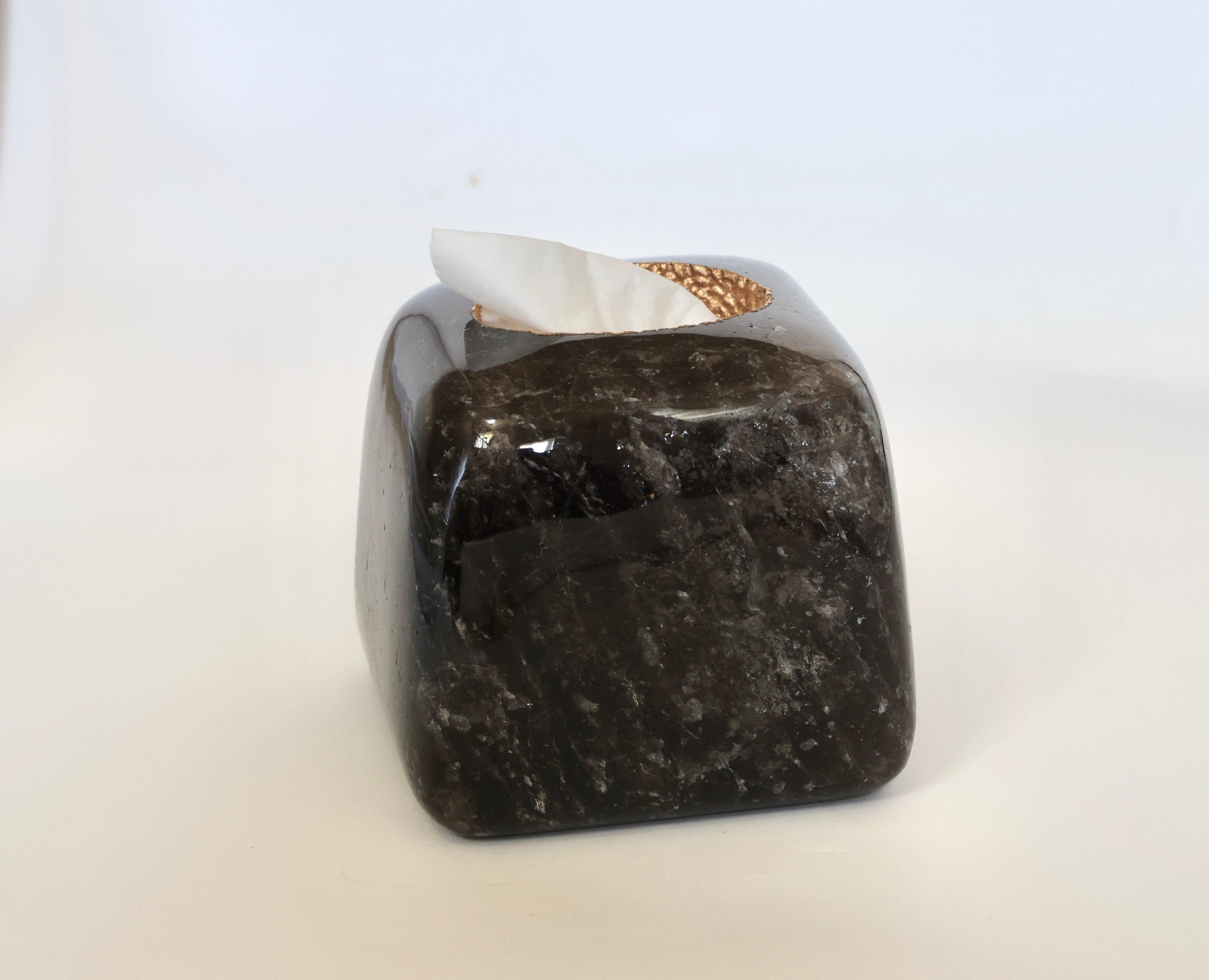 A fine carved natural dark rock crystal tissue box with brass metal decoration on the top rim. Created by Phoenix, NYC.